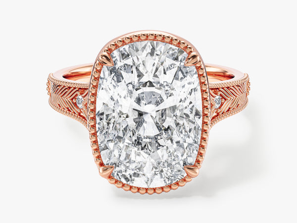 Oval diamond engagement ring in rose gold with intricate band detail