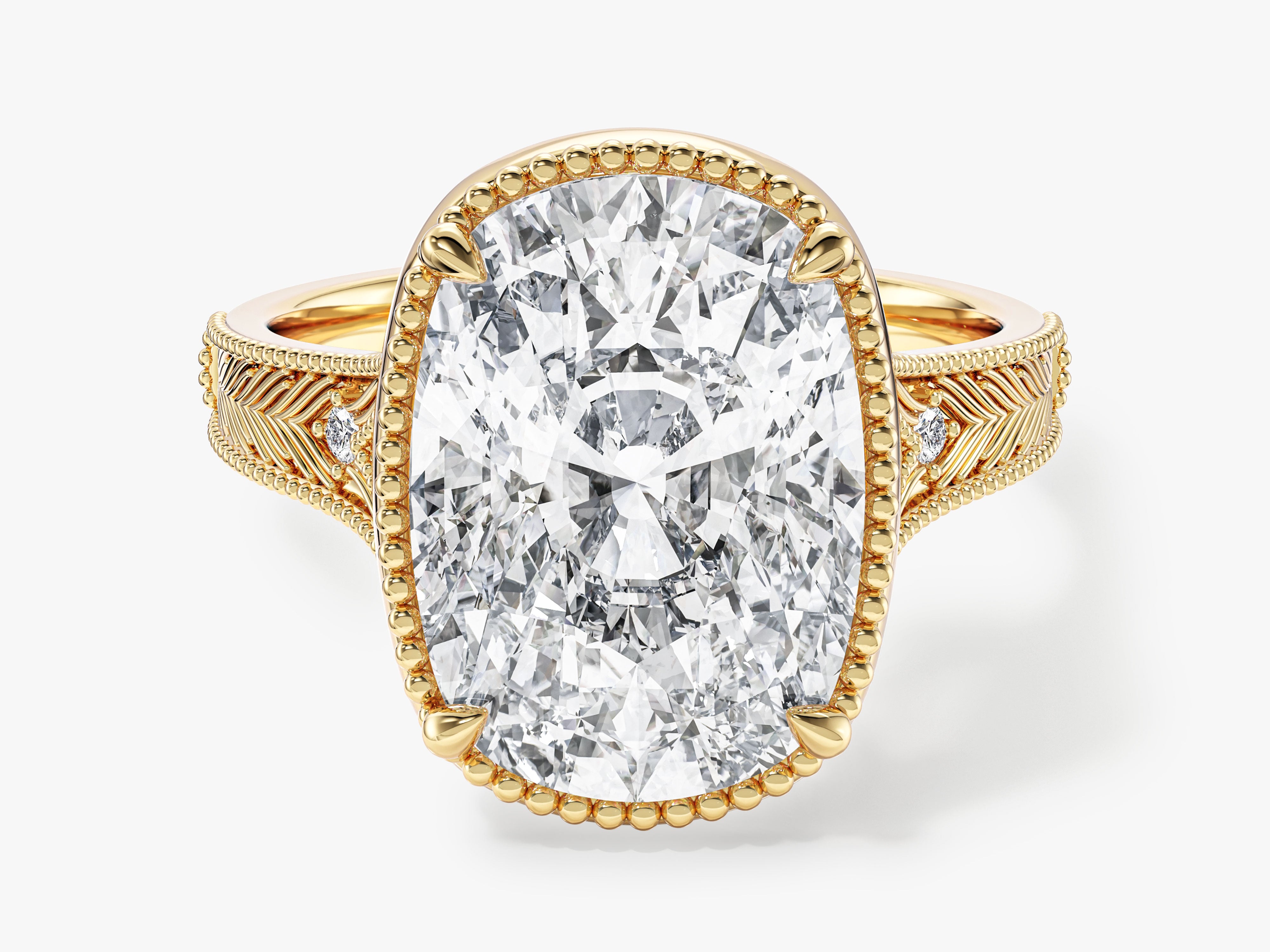 Oval diamond engagement ring in yellow gold with intricate band details