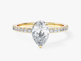 Sidestone Accent Pear Cut Moissanite Engagement Ring