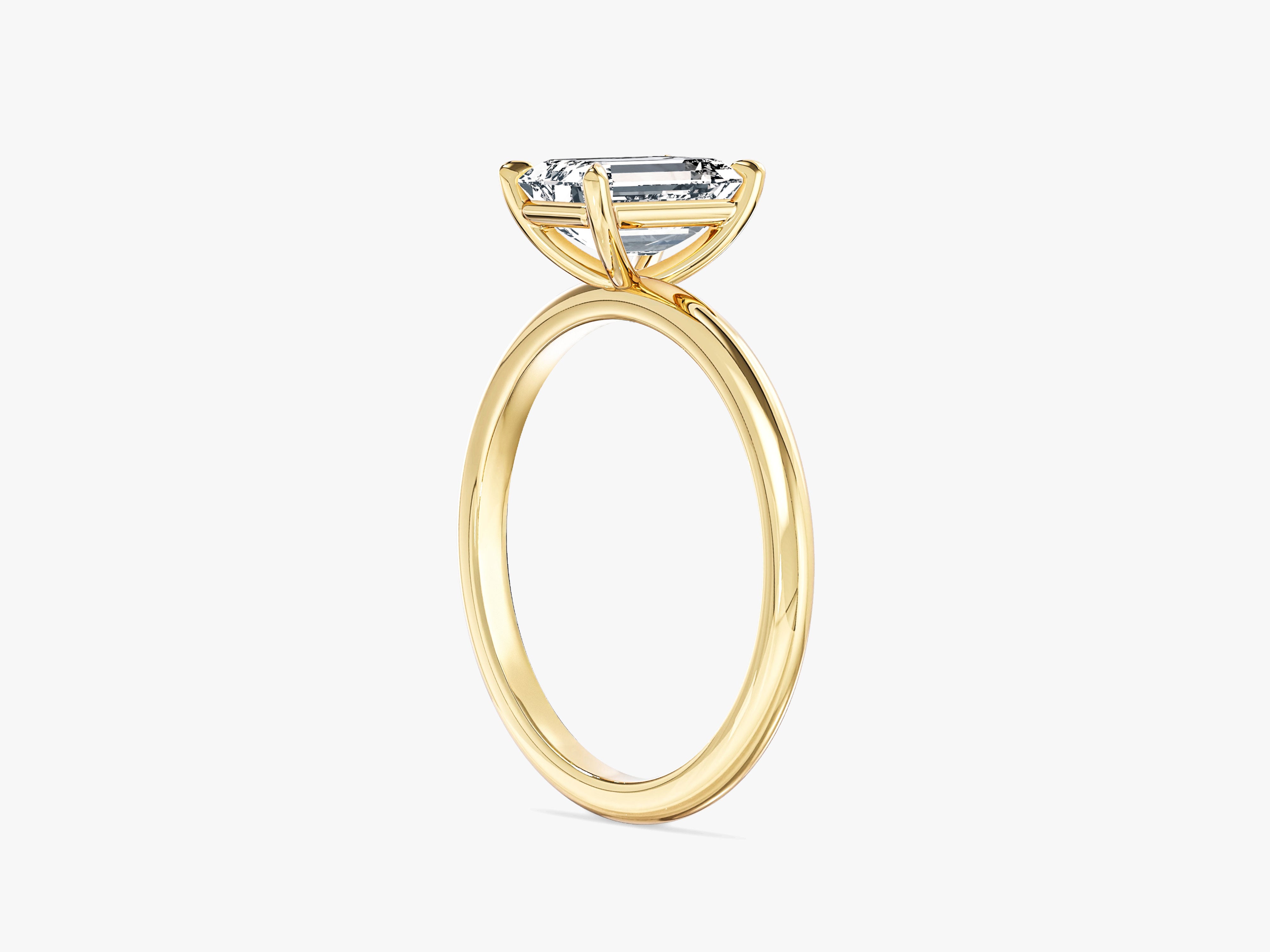 Emerald cut diamond ring in yellow gold setting