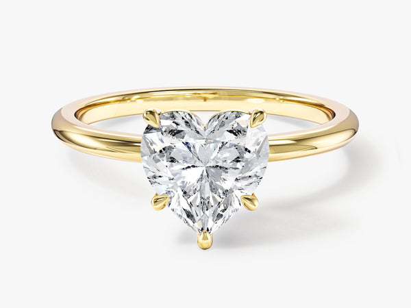 Gold ring with heart-shaped diamond engagement ring