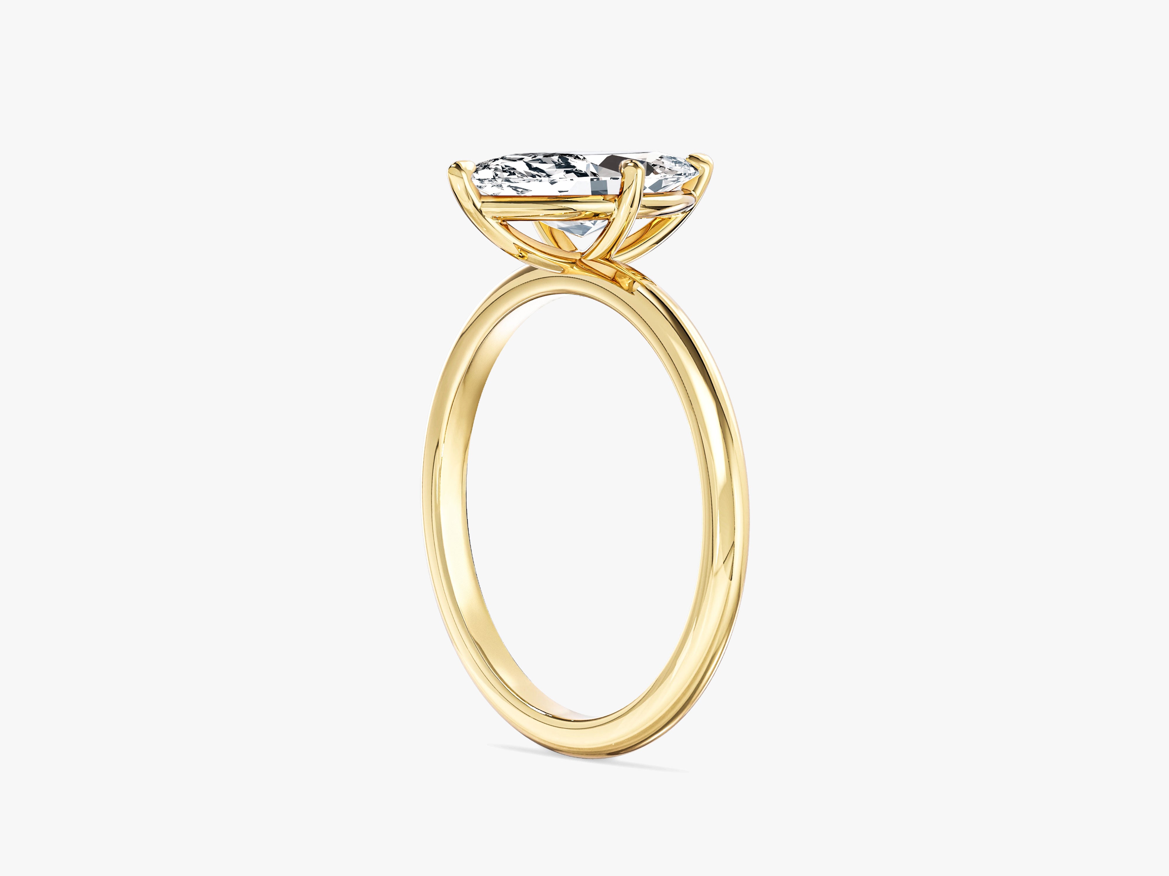 Marquise diamond engagement ring in yellow gold