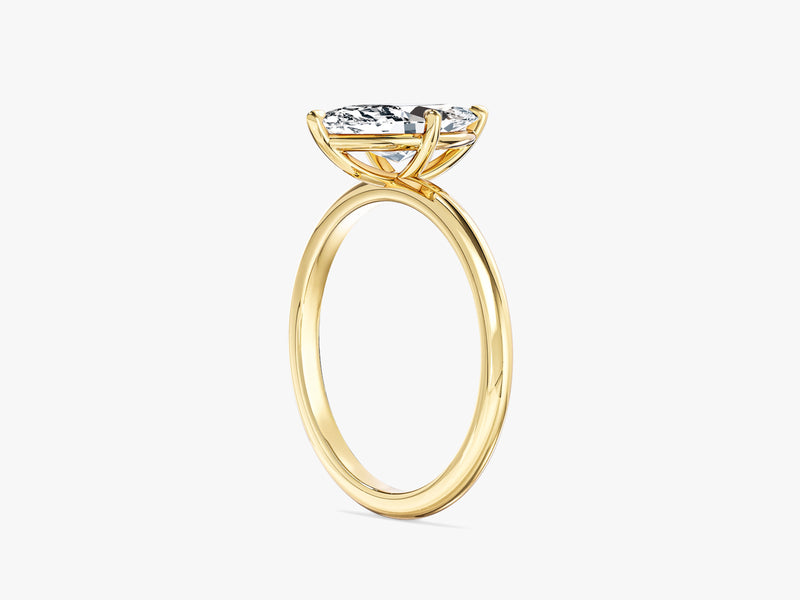 Marquise diamond engagement ring in yellow gold
