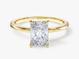 Radiant cut diamond engagement ring in yellow gold setting