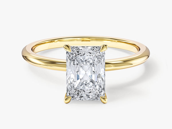 Radiant cut diamond engagement ring in yellow gold setting