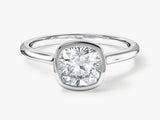 Cushion cut diamond engagement ring in a bezel setting