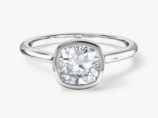 Cushion cut diamond engagement ring in a bezel setting
