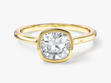 Gold ring with cushion-cut diamond engagement ring