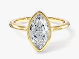 Marquise diamond engagement ring in yellow gold setting