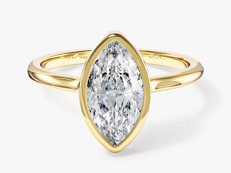 Marquise diamond engagement ring in yellow gold setting