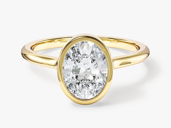 Oval diamond engagement ring in yellow gold setting