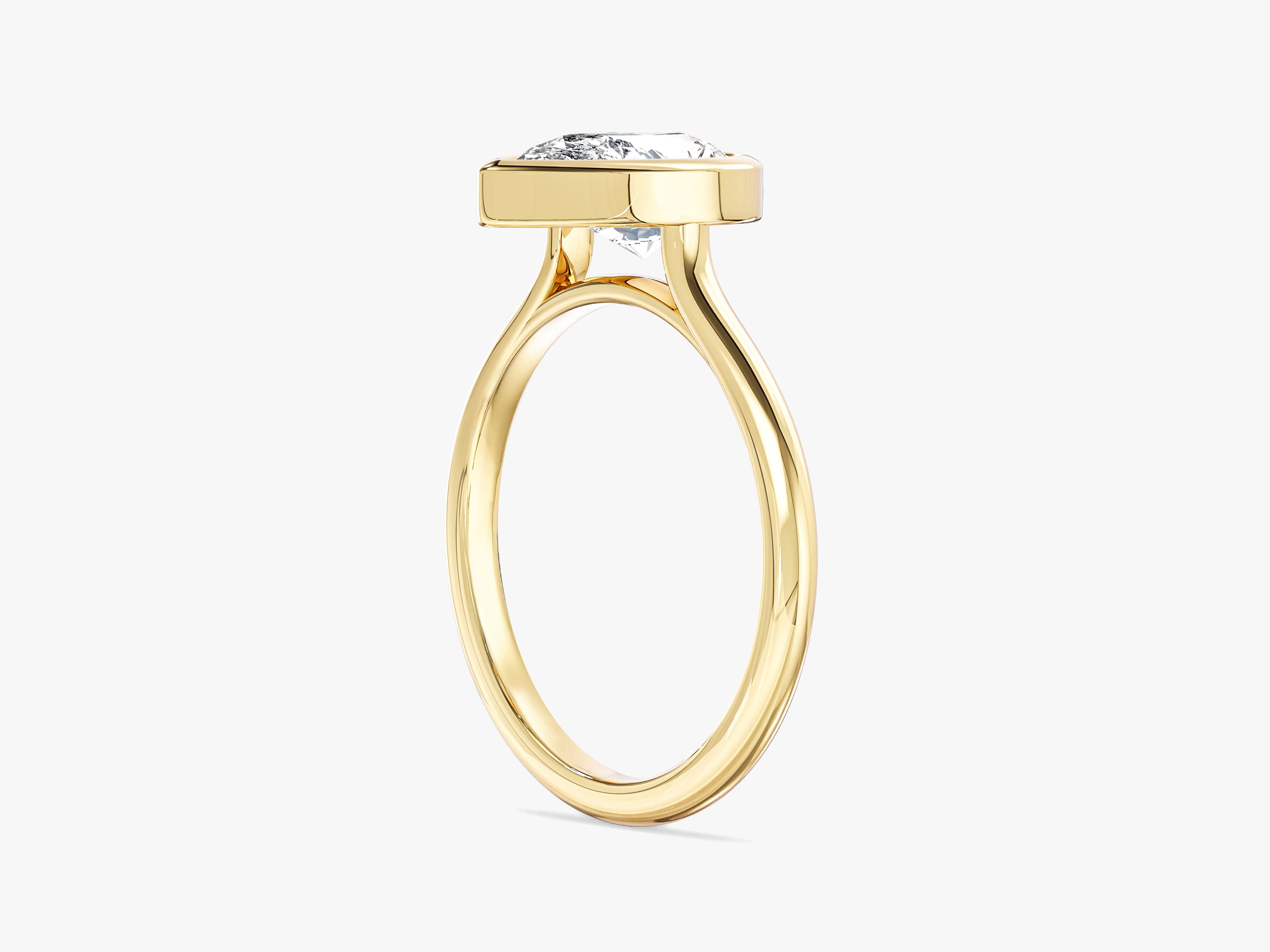 Gold ring with bezel-set diamond, fine jewelry