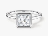 Princess cut diamond engagement ring in a bezel setting