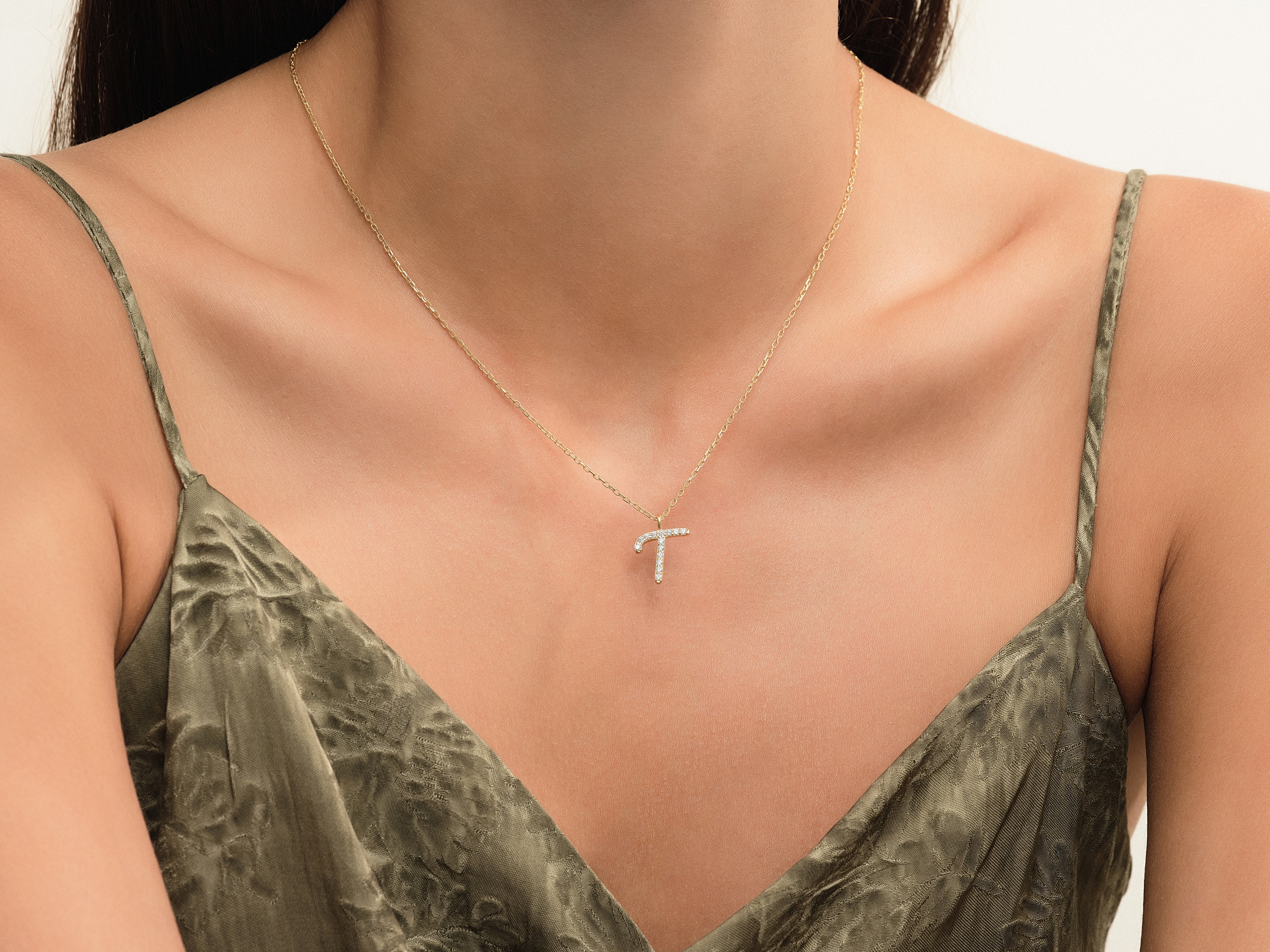 Diamond letter T necklace on gold chain jewelry
