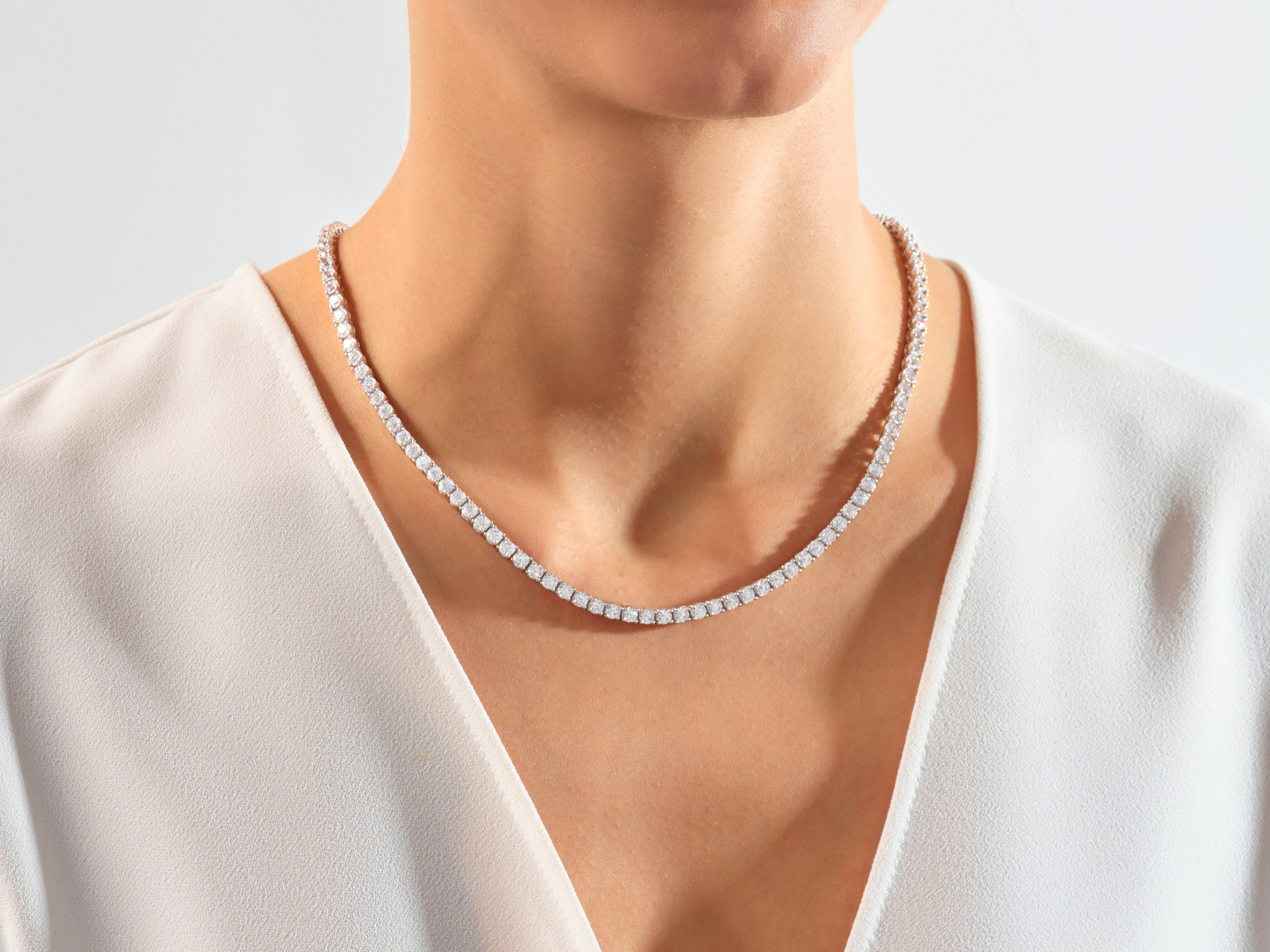 Diamond tennis necklace on a woman's neck, jewelry