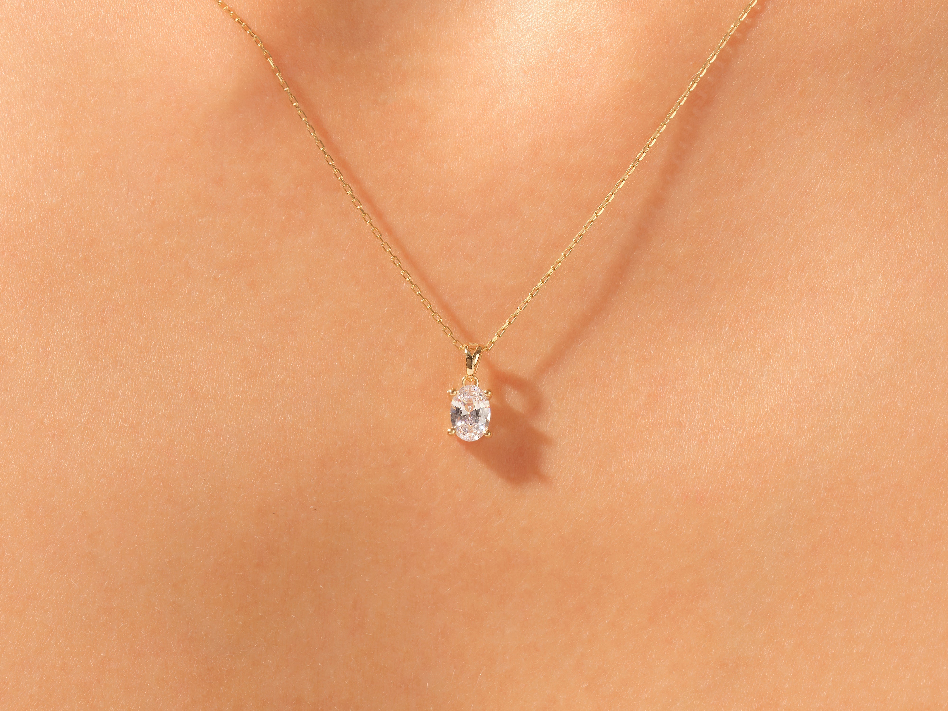 Gold necklace with oval diamond pendant, fine jewelry