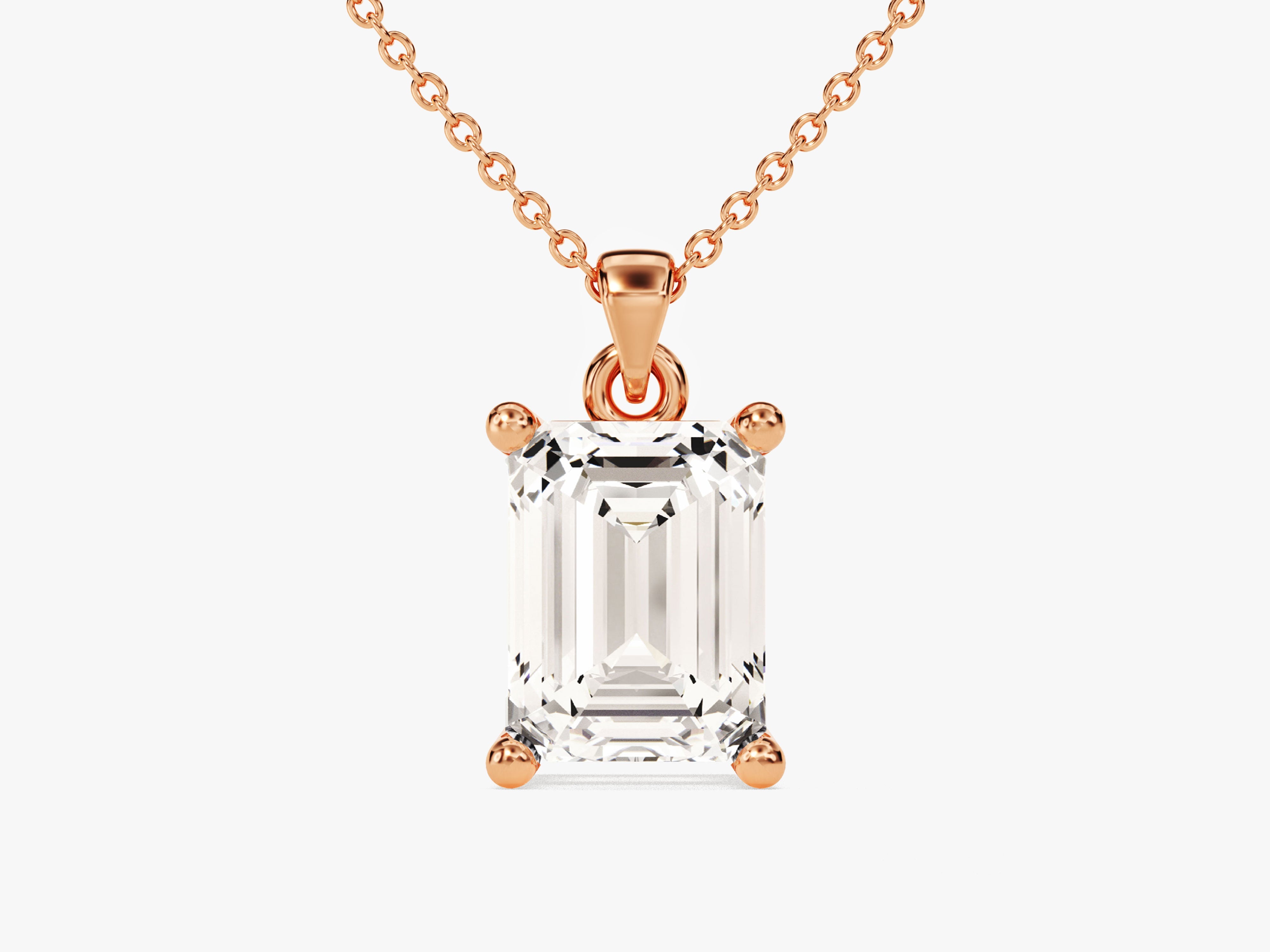 Emerald cut diamond pendant necklace in rose gold