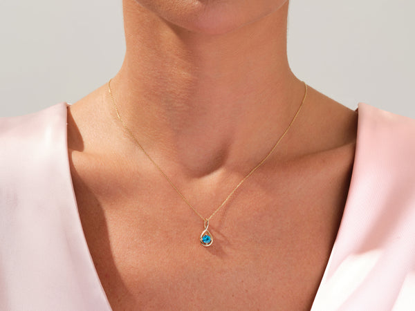 Infinity Solitaire Blue Topaz Necklace in 14k Solid Gold