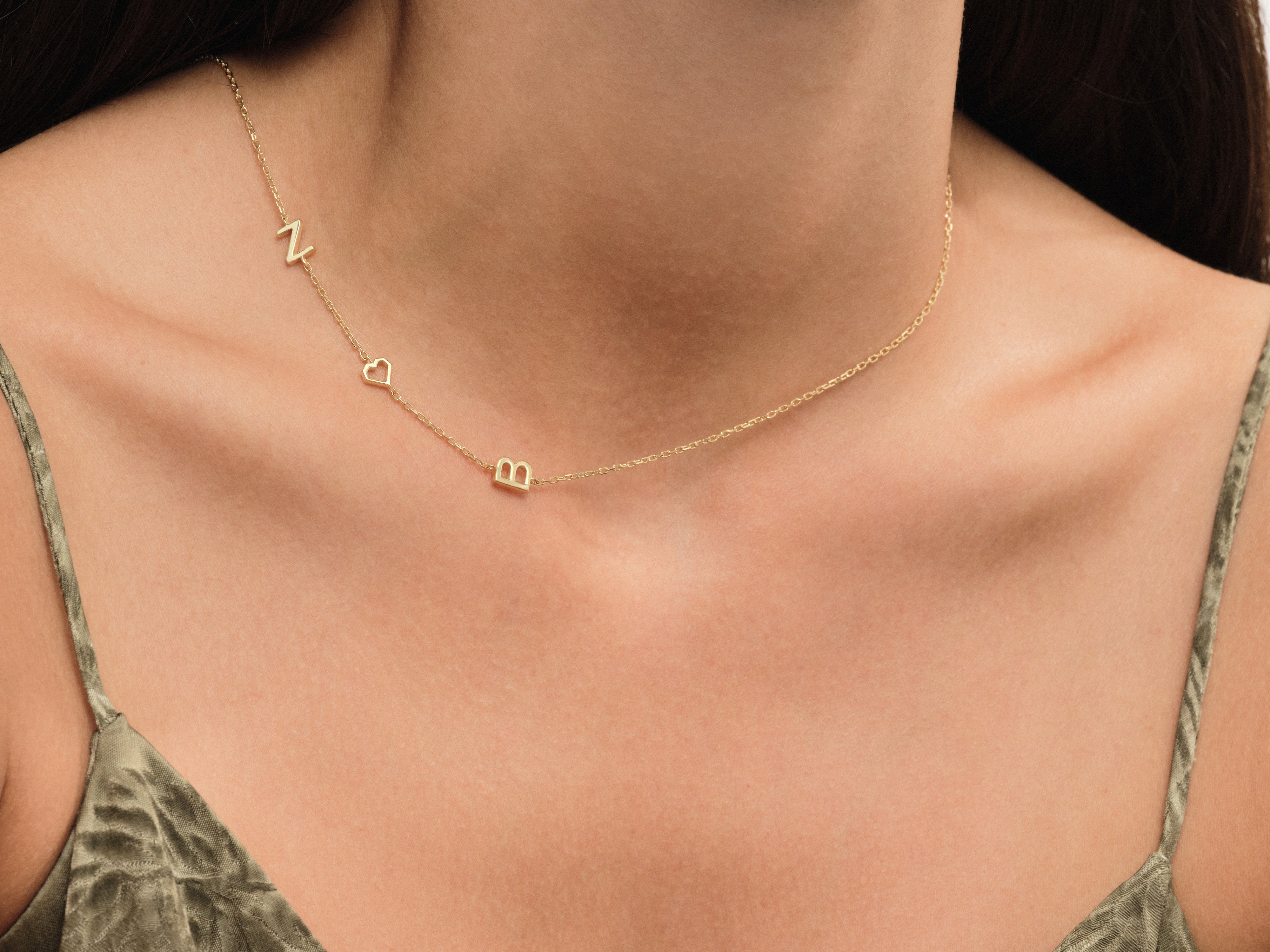 Gold initial necklace with heart charm from jewelry company