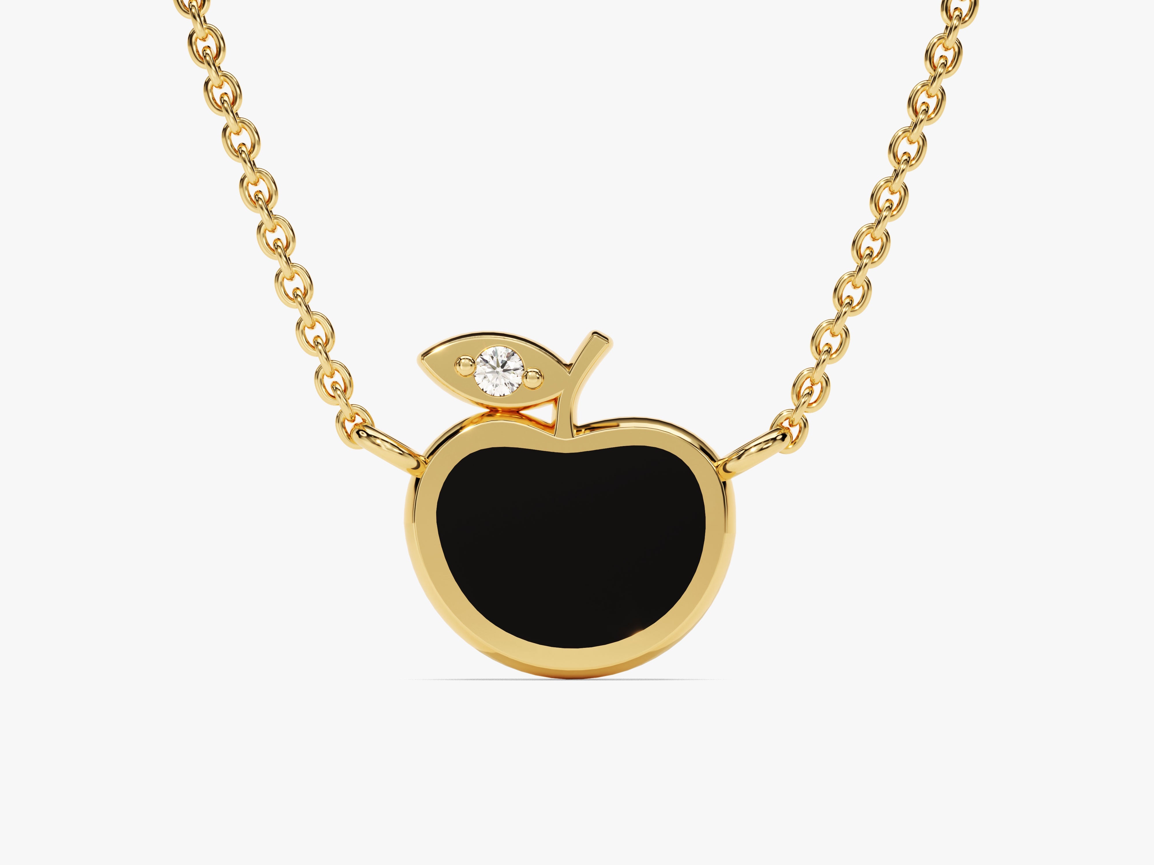 Gold apple necklace with diamond accent and black enamel pendant