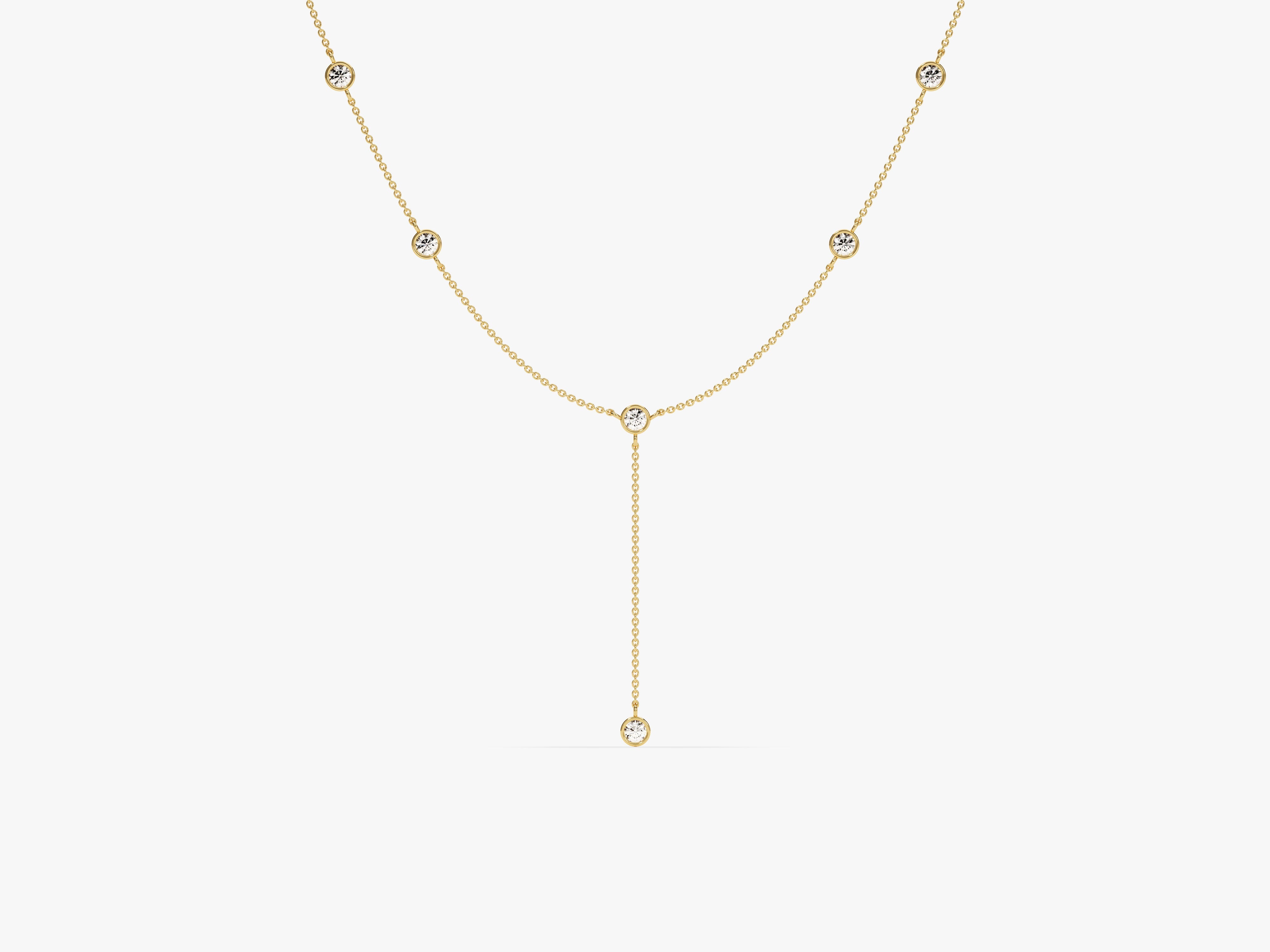 Gold y-necklace with bezel-set diamonds, fine jewelry