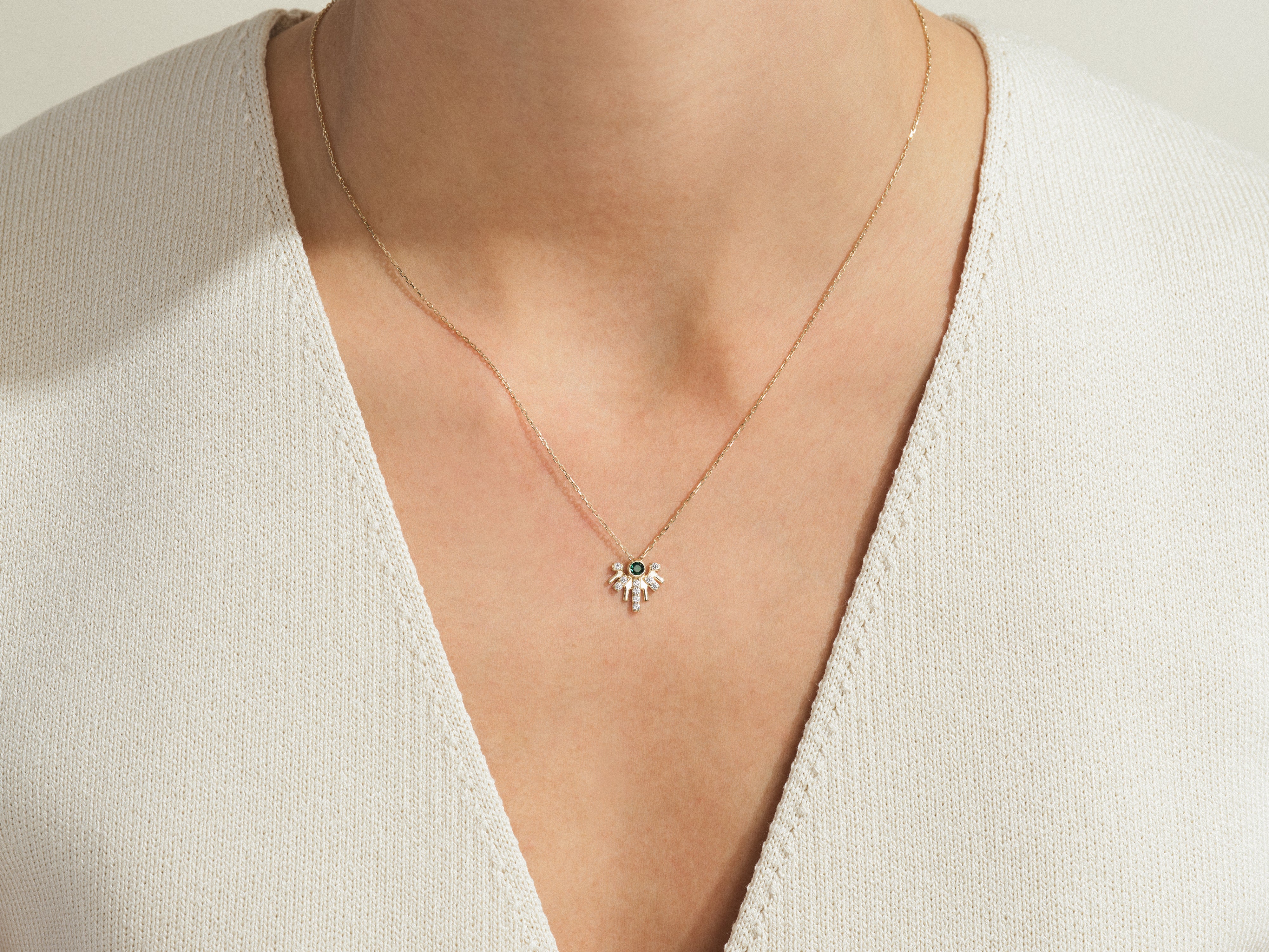 Gold necklace with evil eye charm and diamonds