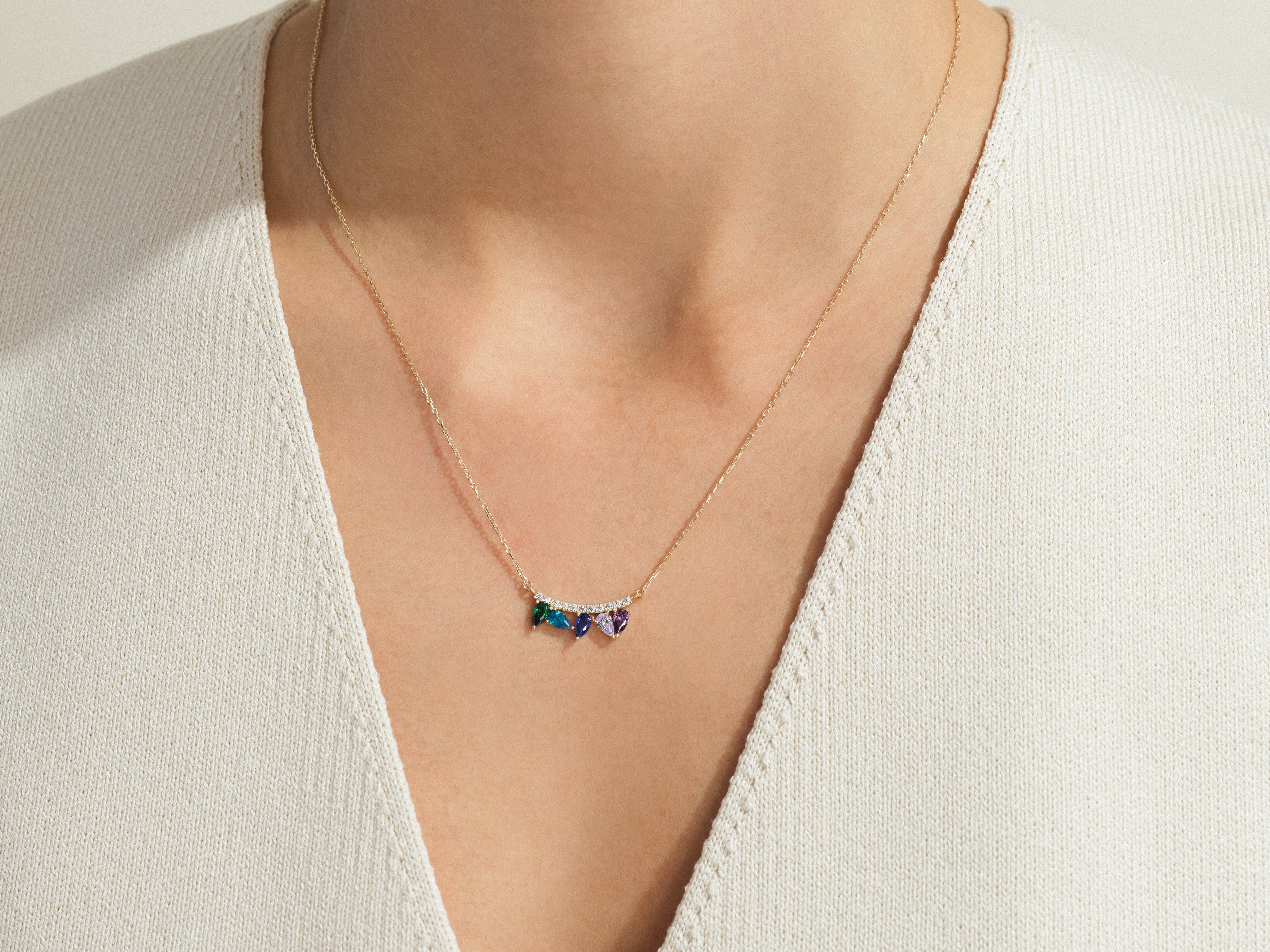 Gold necklace with colorful gemstones and diamonds