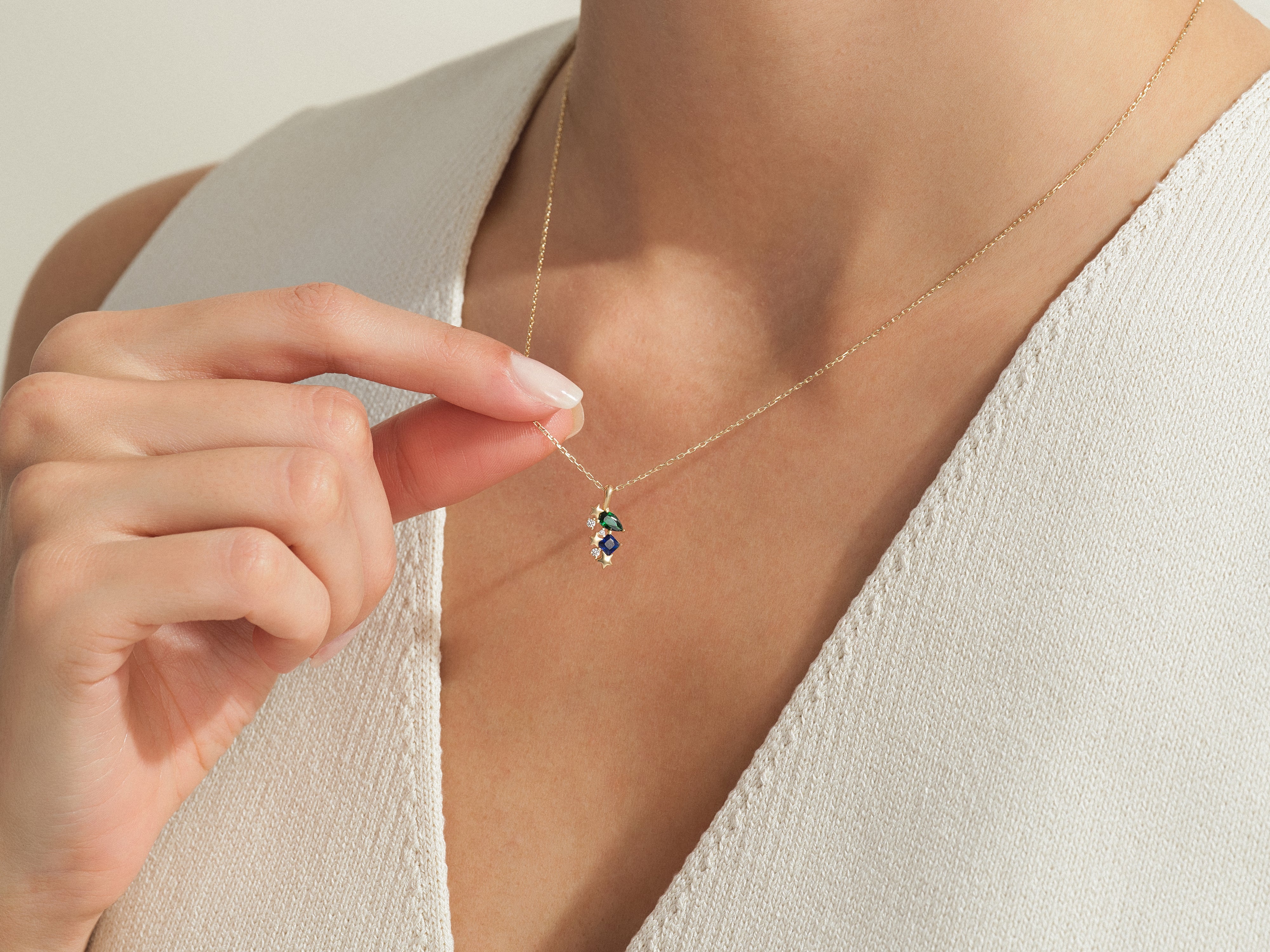 Gold necklace with colorful gemstone cluster pendant