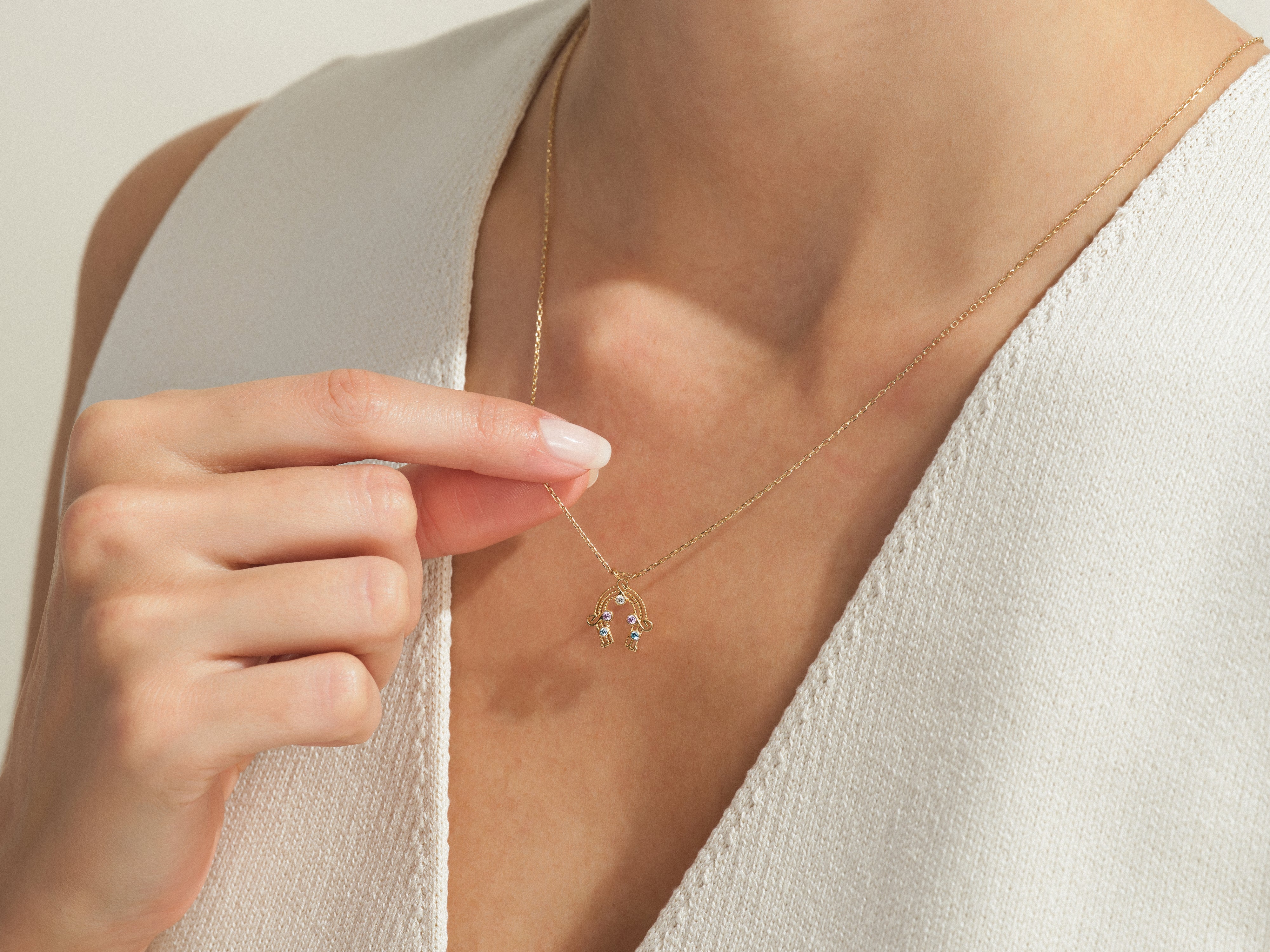 Gold rainbow necklace with colorful gemstones, jewelry