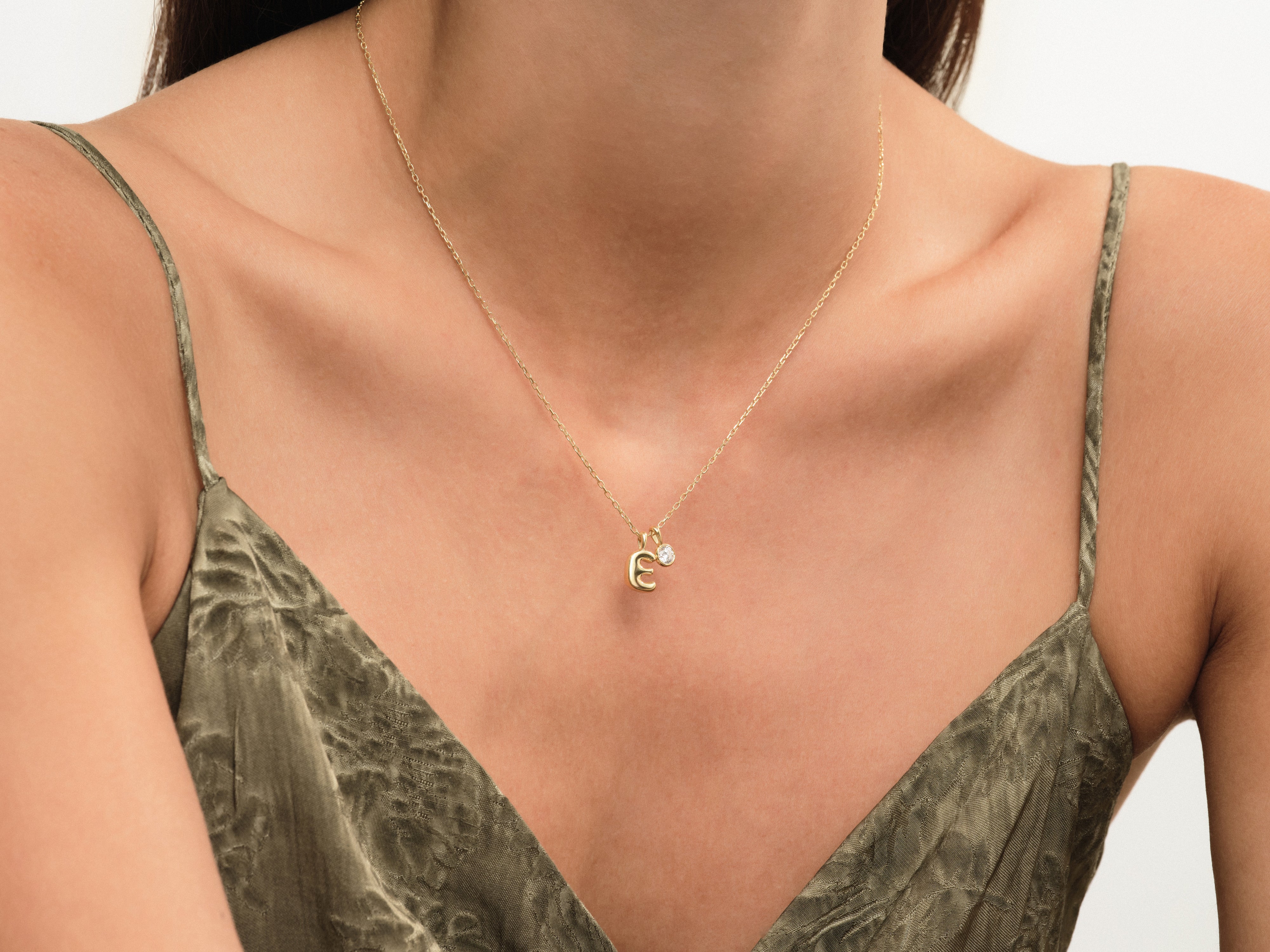 Gold letter 'E' necklace with diamond accent, fine jewelry