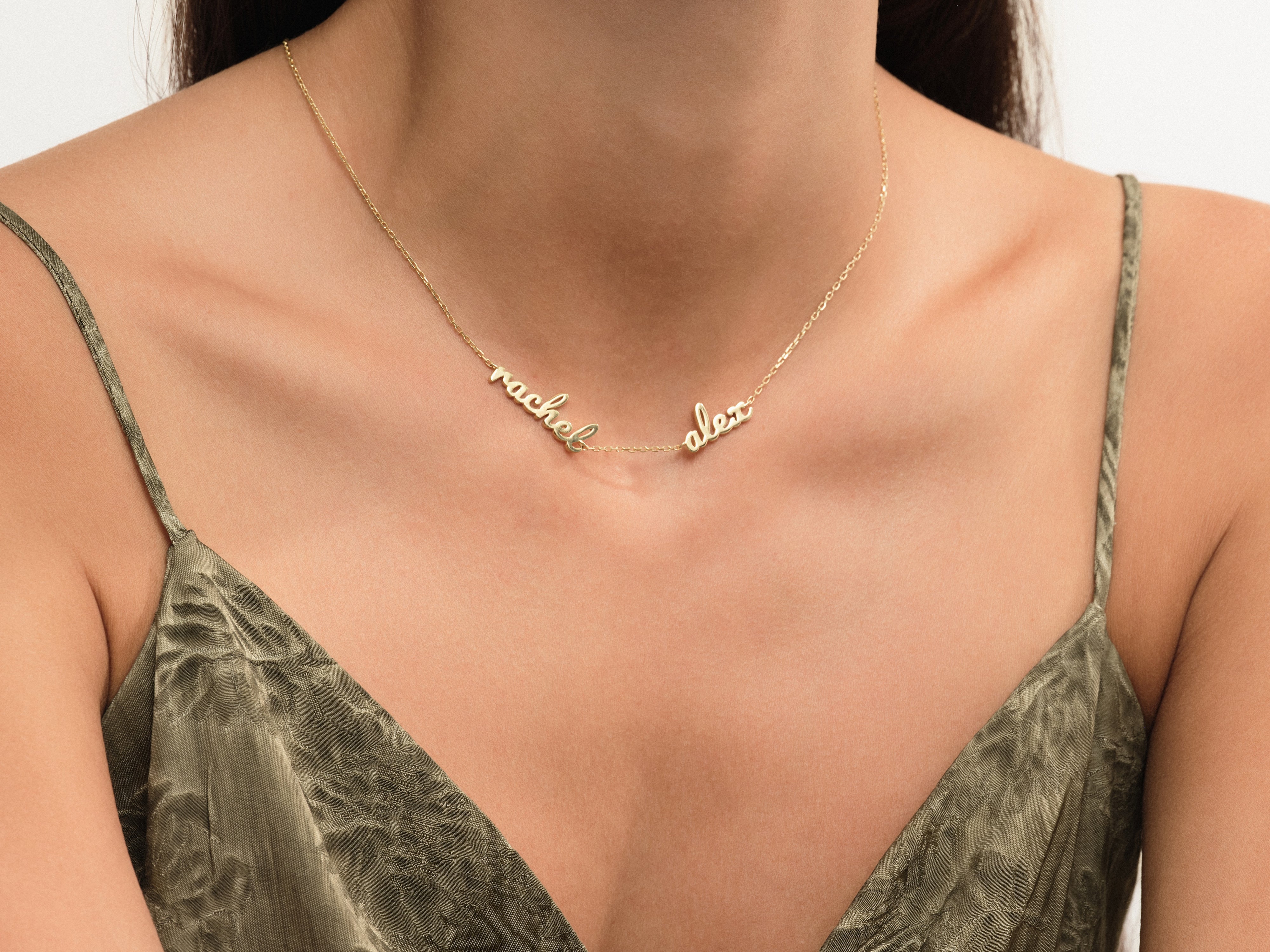 Gold name necklace with "rachel" and "alex" for jewelry lovers
