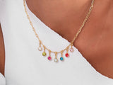 Gold necklace with colorful gemstone charms, fine jewelry