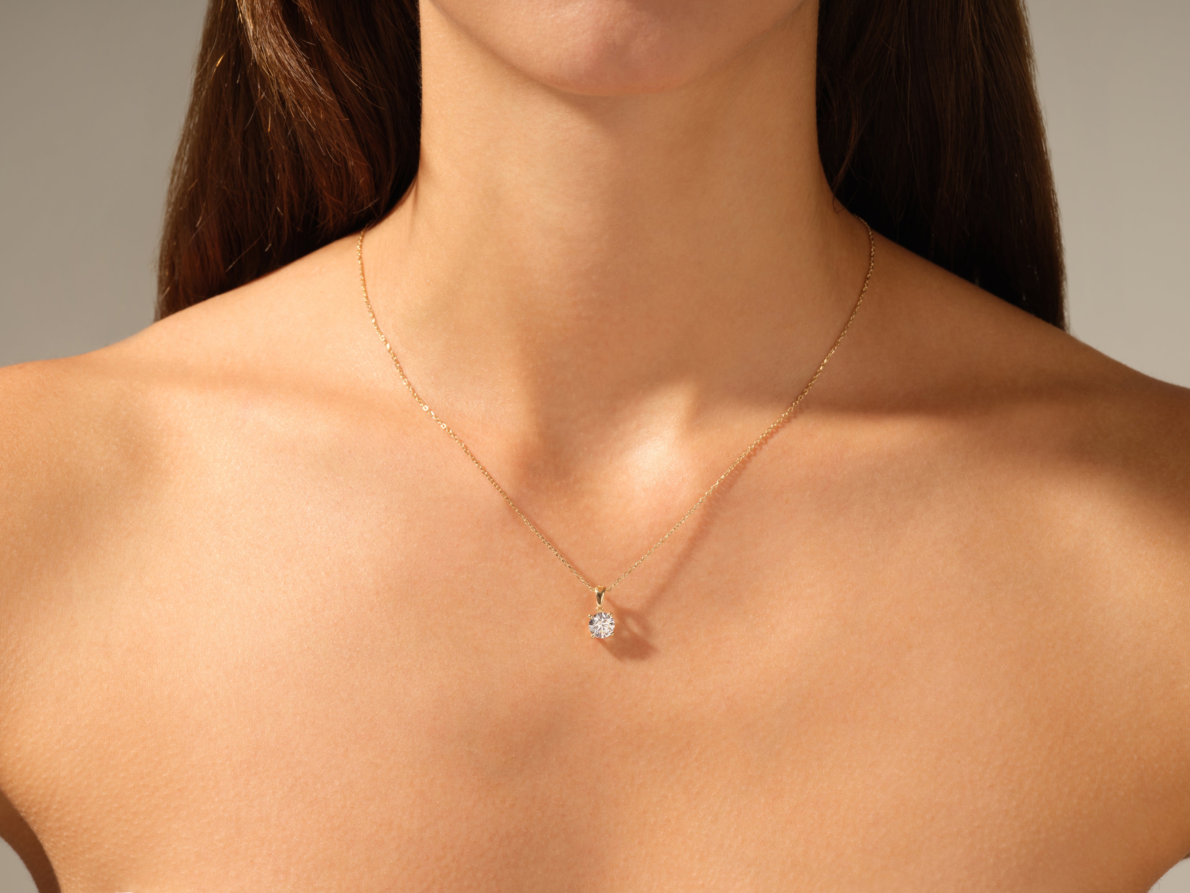 Diamond pendant necklace on a woman's neck, fine jewelry