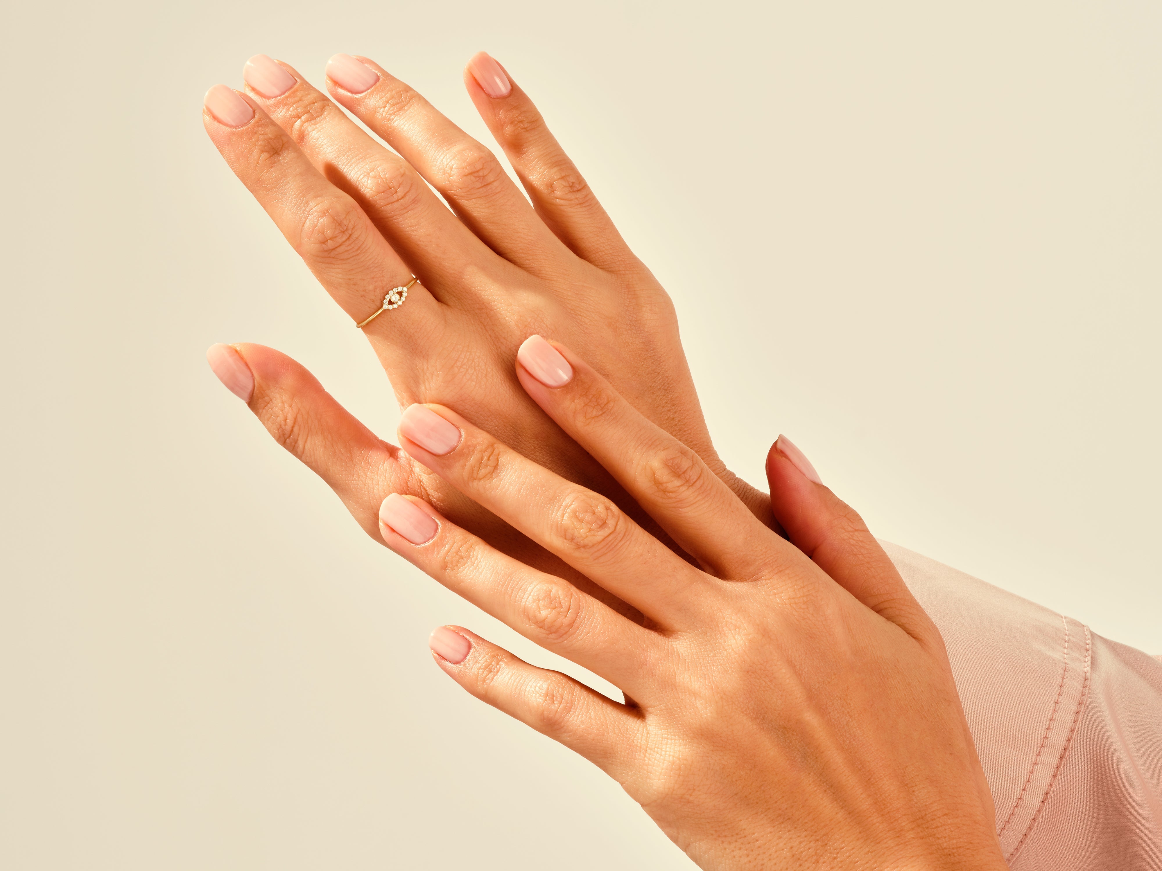 Diamond ring on elegant hand, jewelry photography