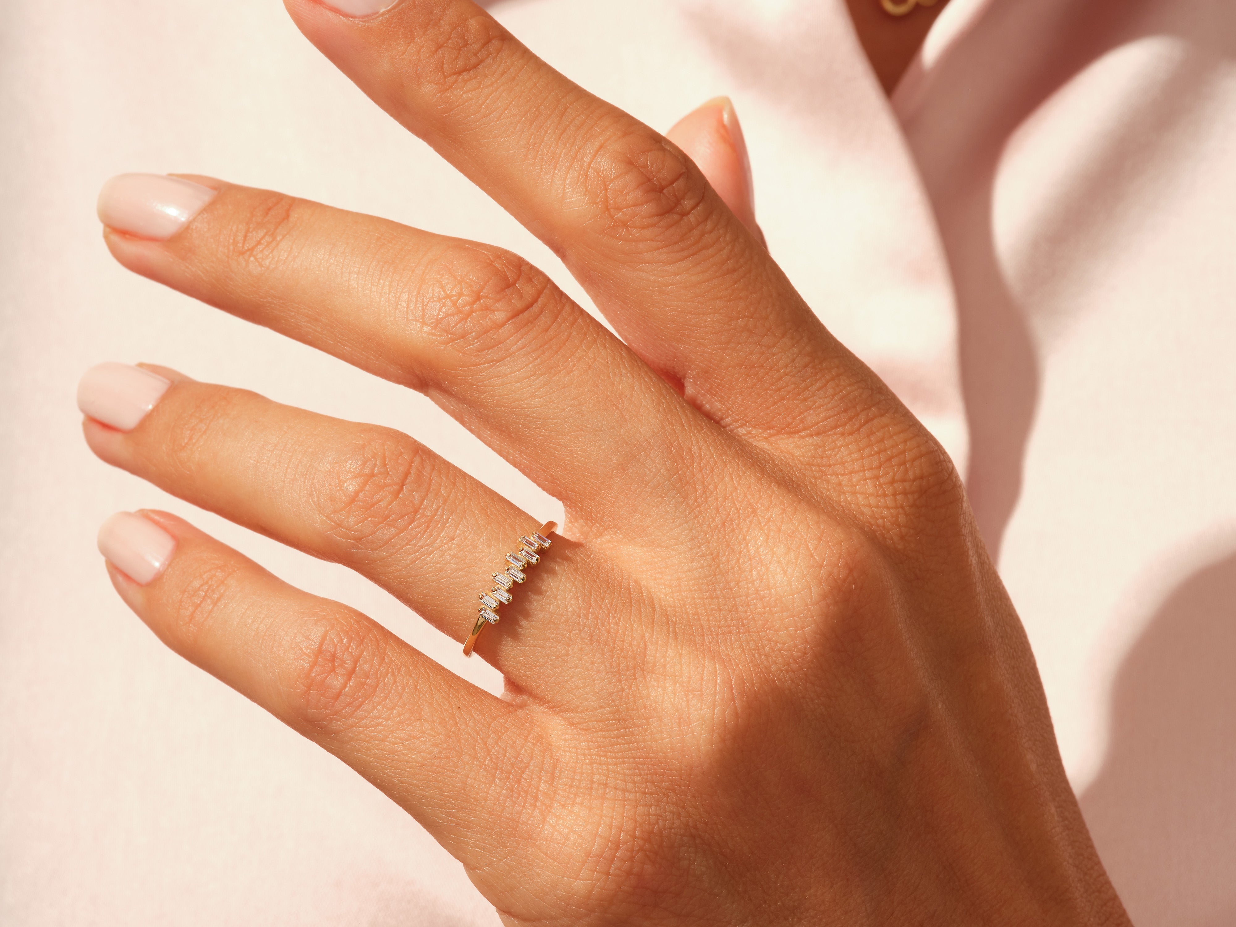 Diamond baguette ring on a hand, jewelry photography