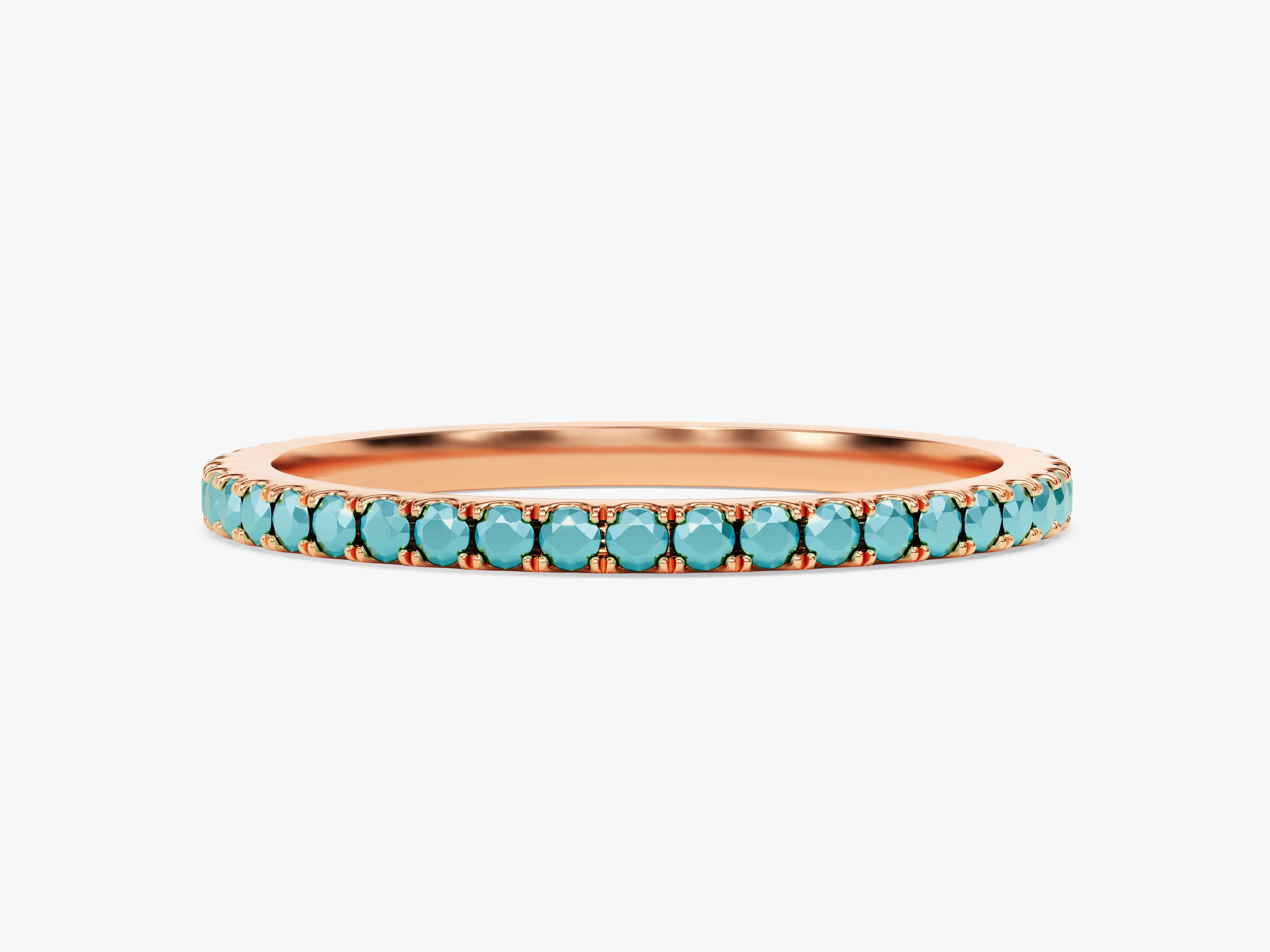 Rose gold eternity band with turquoise gemstones