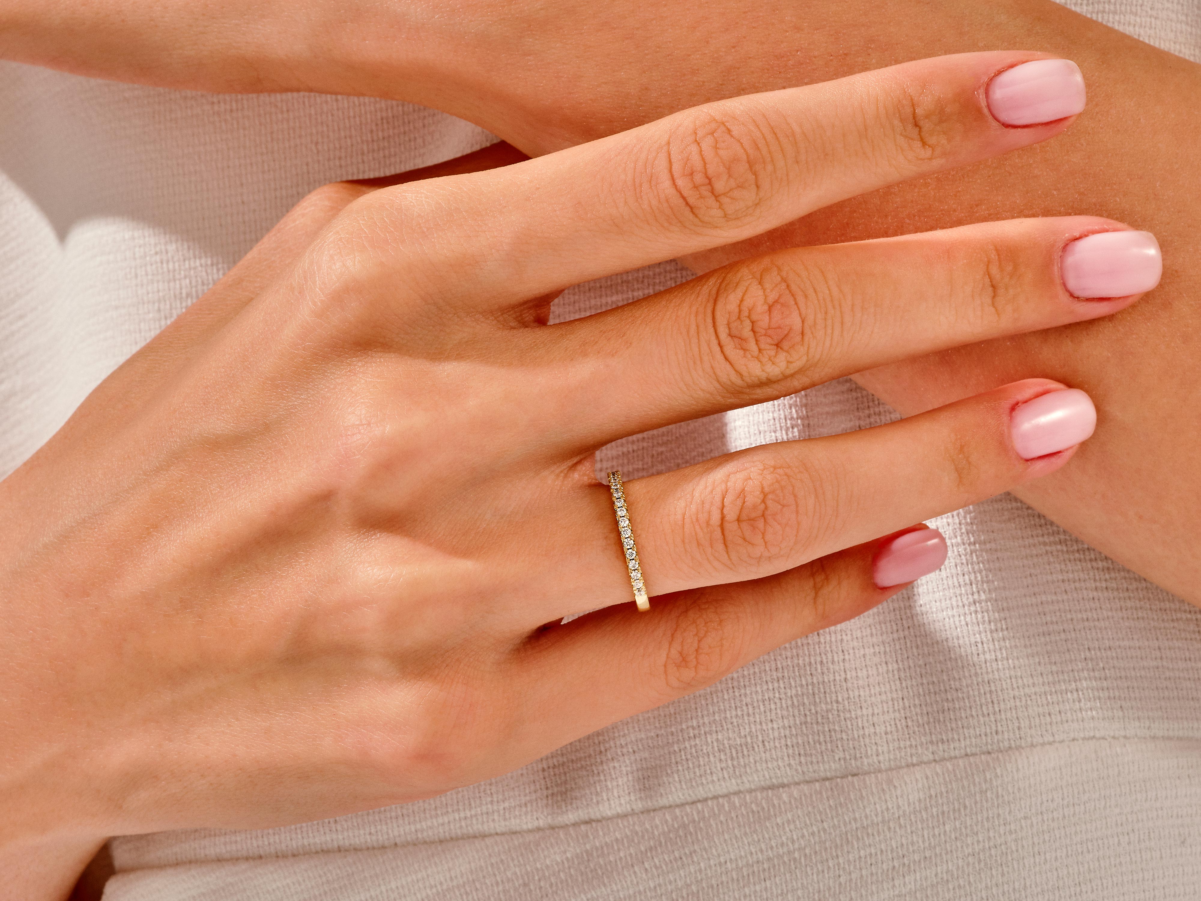 Diamond eternity ring on a hand, jewelry product photography