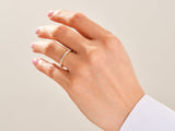Diamond eternity ring on a woman's hand, jewelry photography