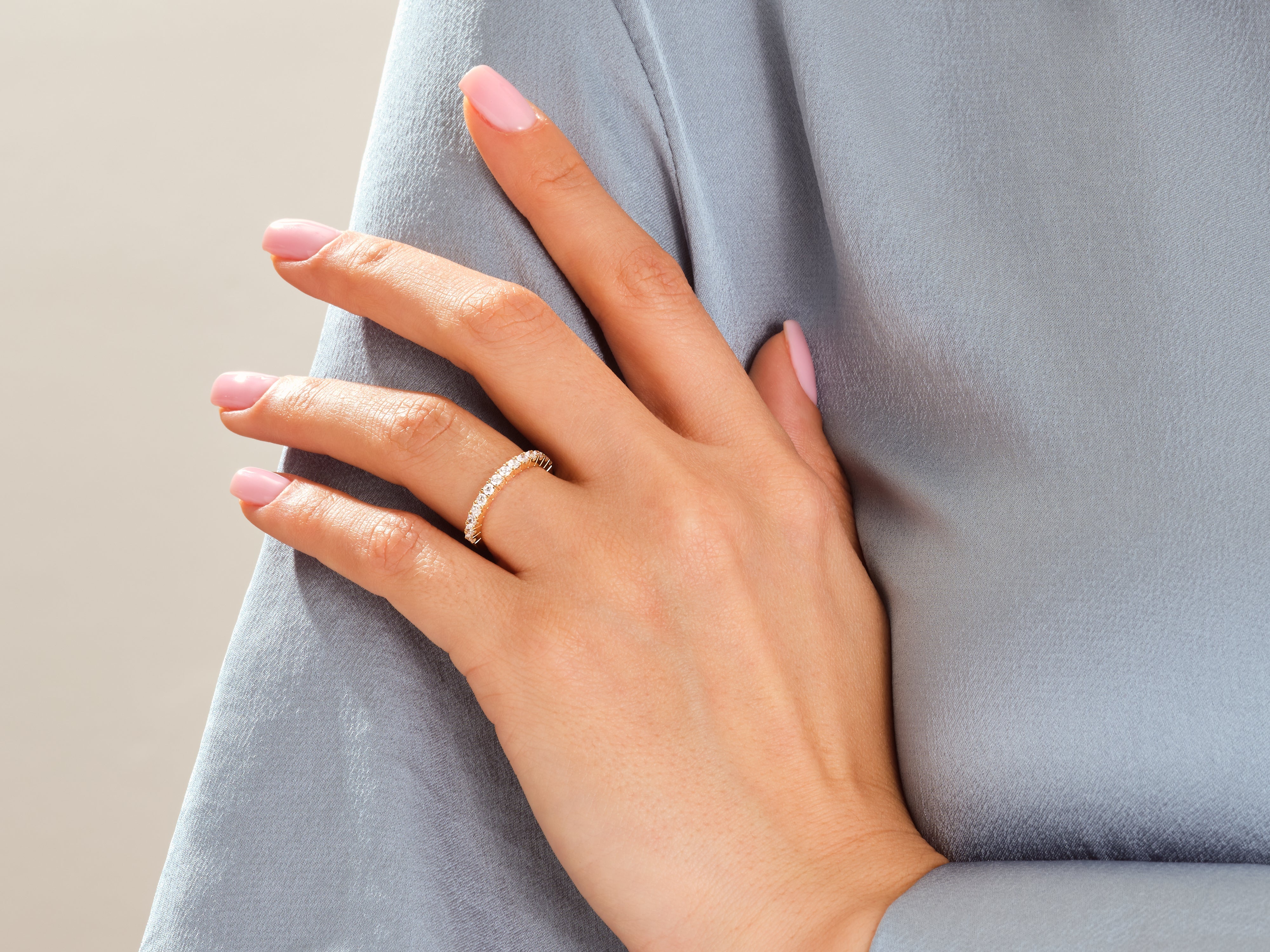 Diamond eternity ring on a hand, jewelry product photography