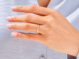 Gold diamond ring on a woman's finger, jewelry