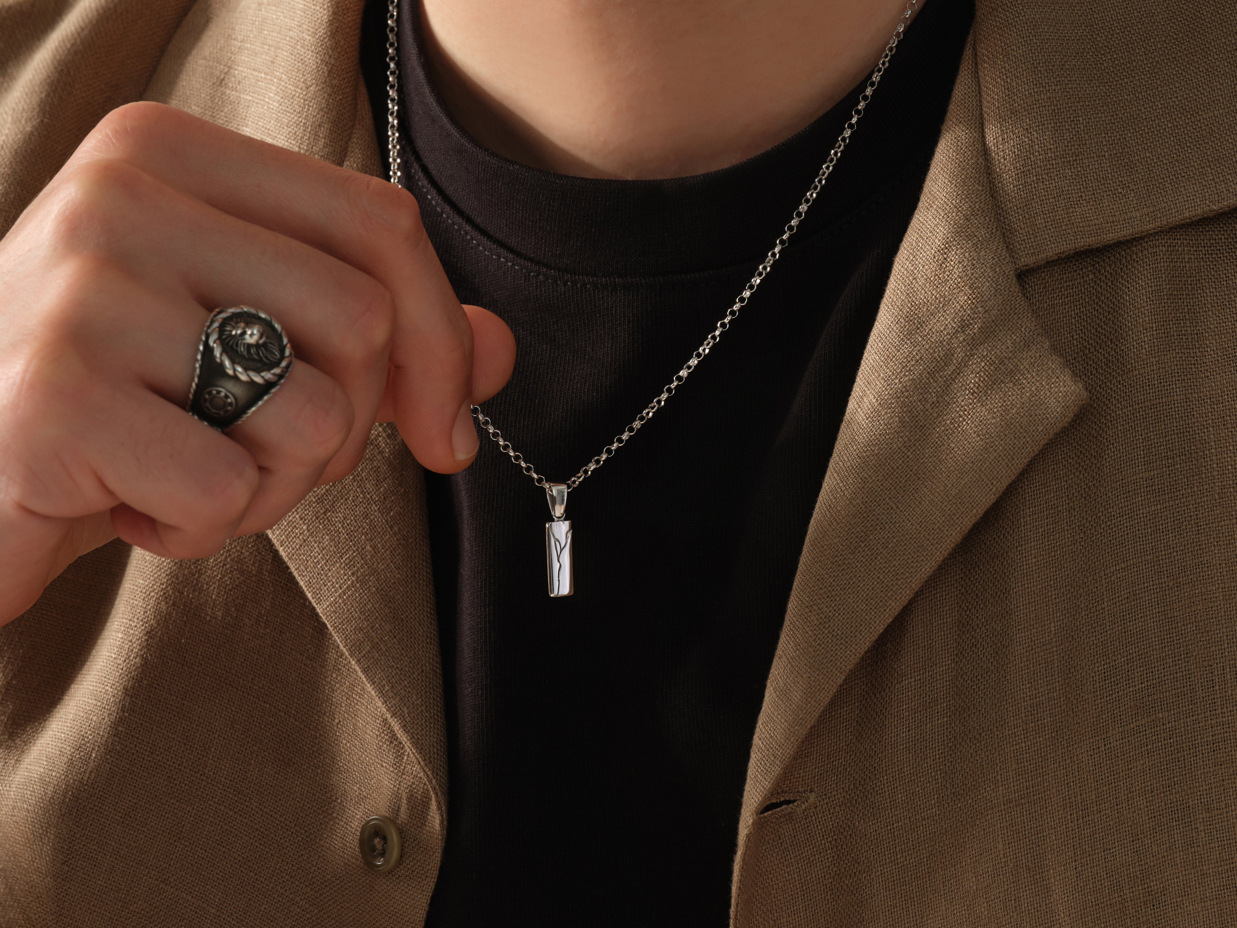 Men's silver pendant necklace and ring from jewelry brand