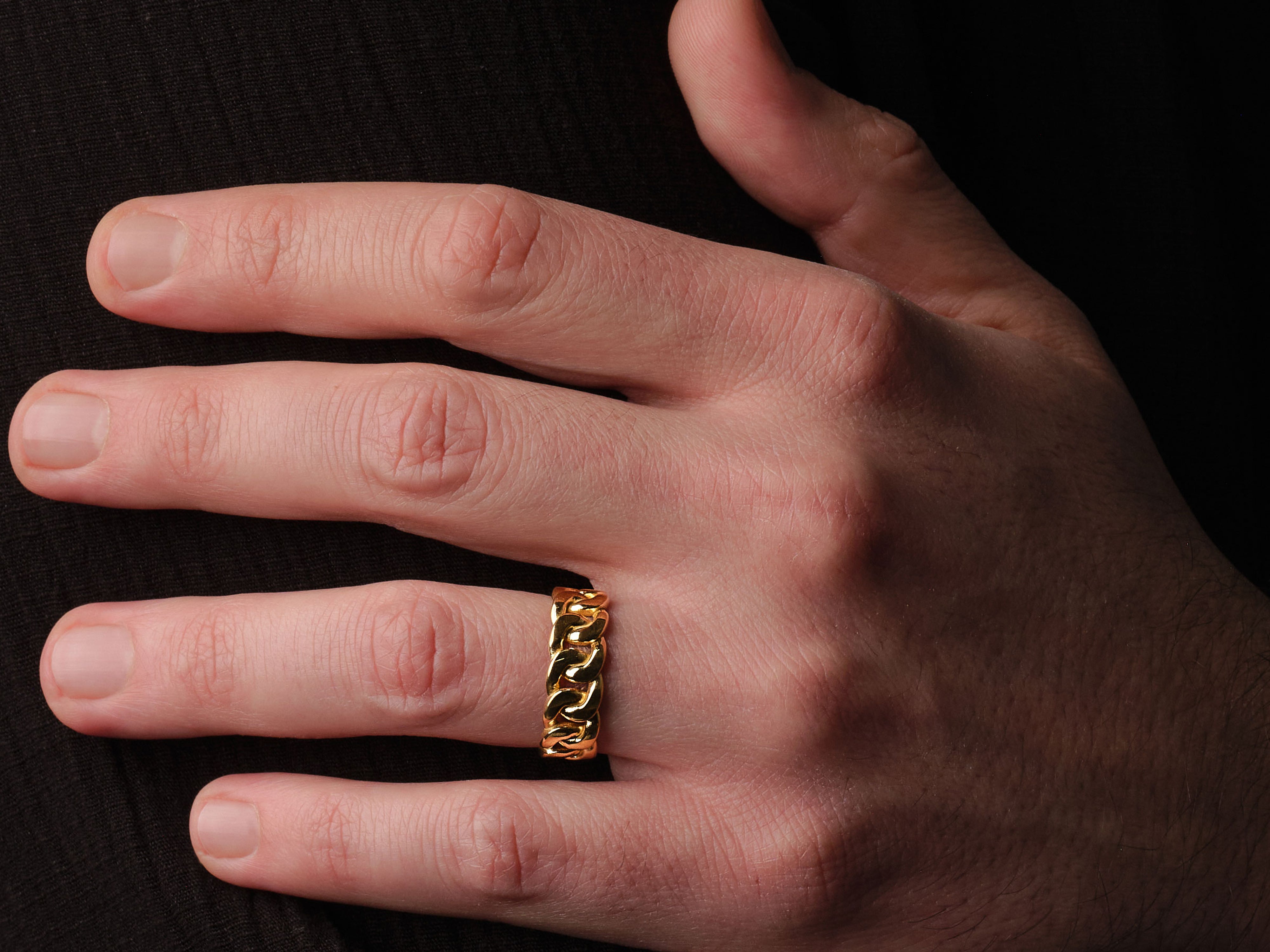 Gold cuban link ring on hand, luxury jewelry for men