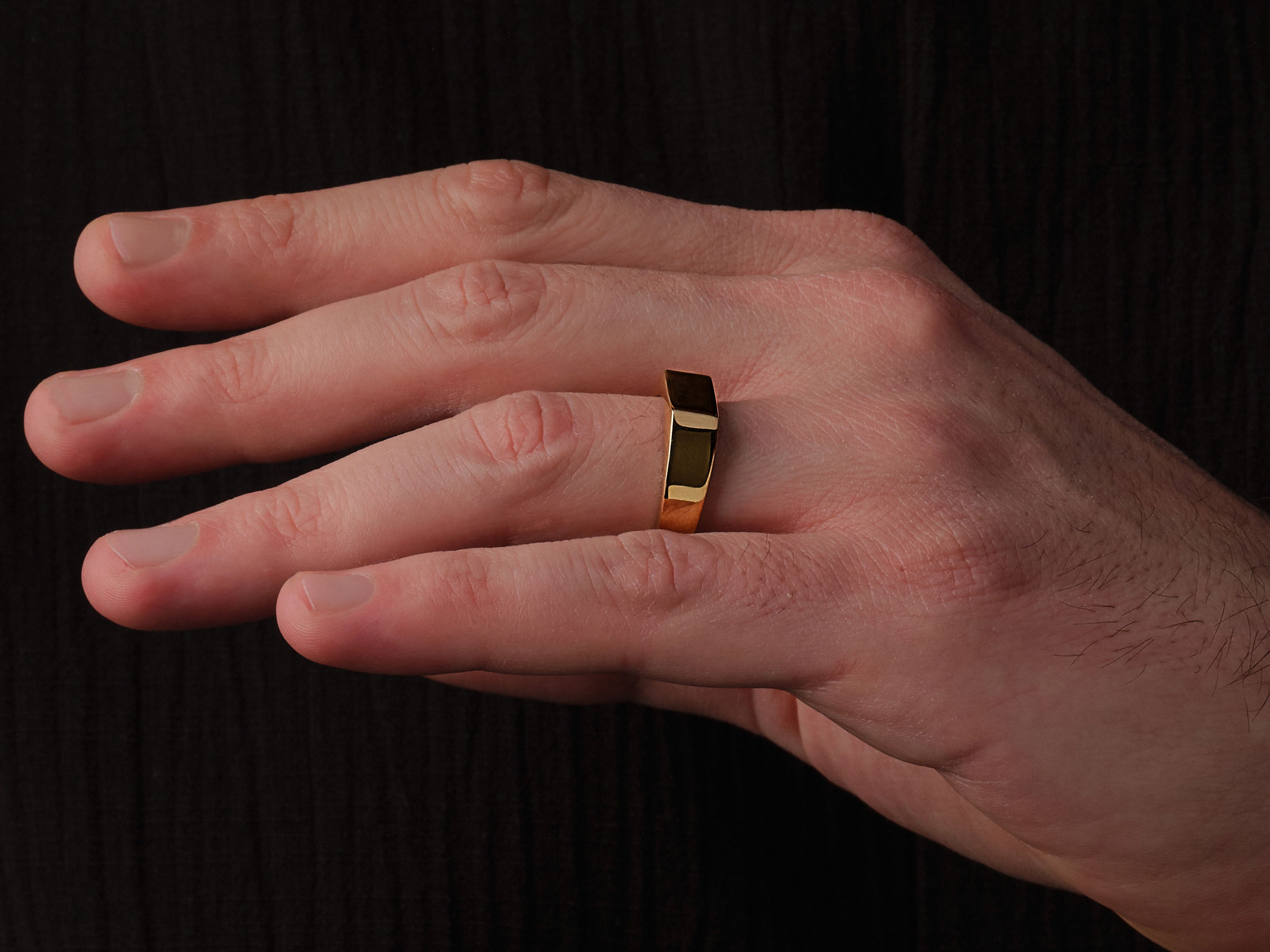 Gold ring on hand, modern jewelry design