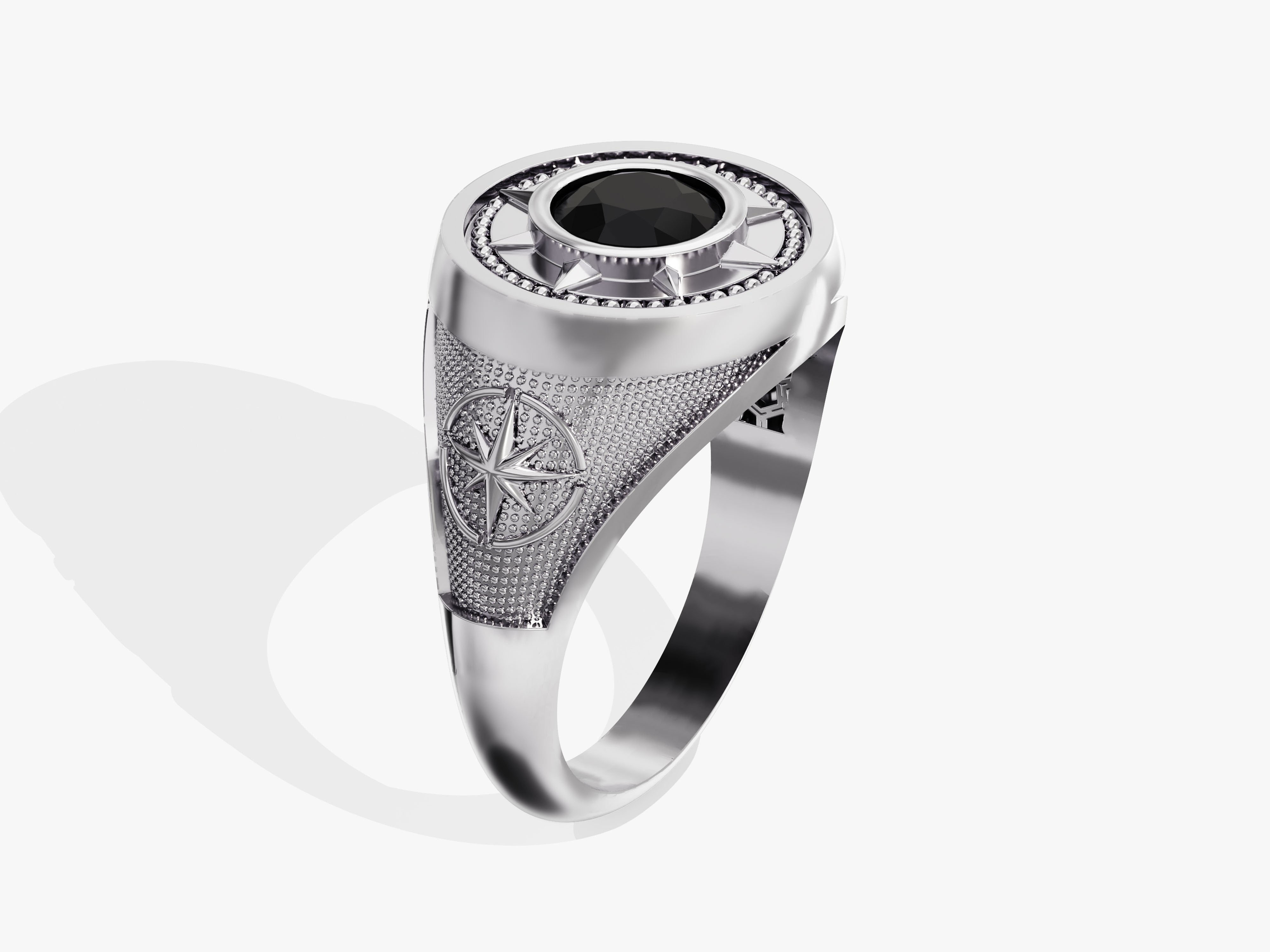 Silver ring with black gemstone and compass design