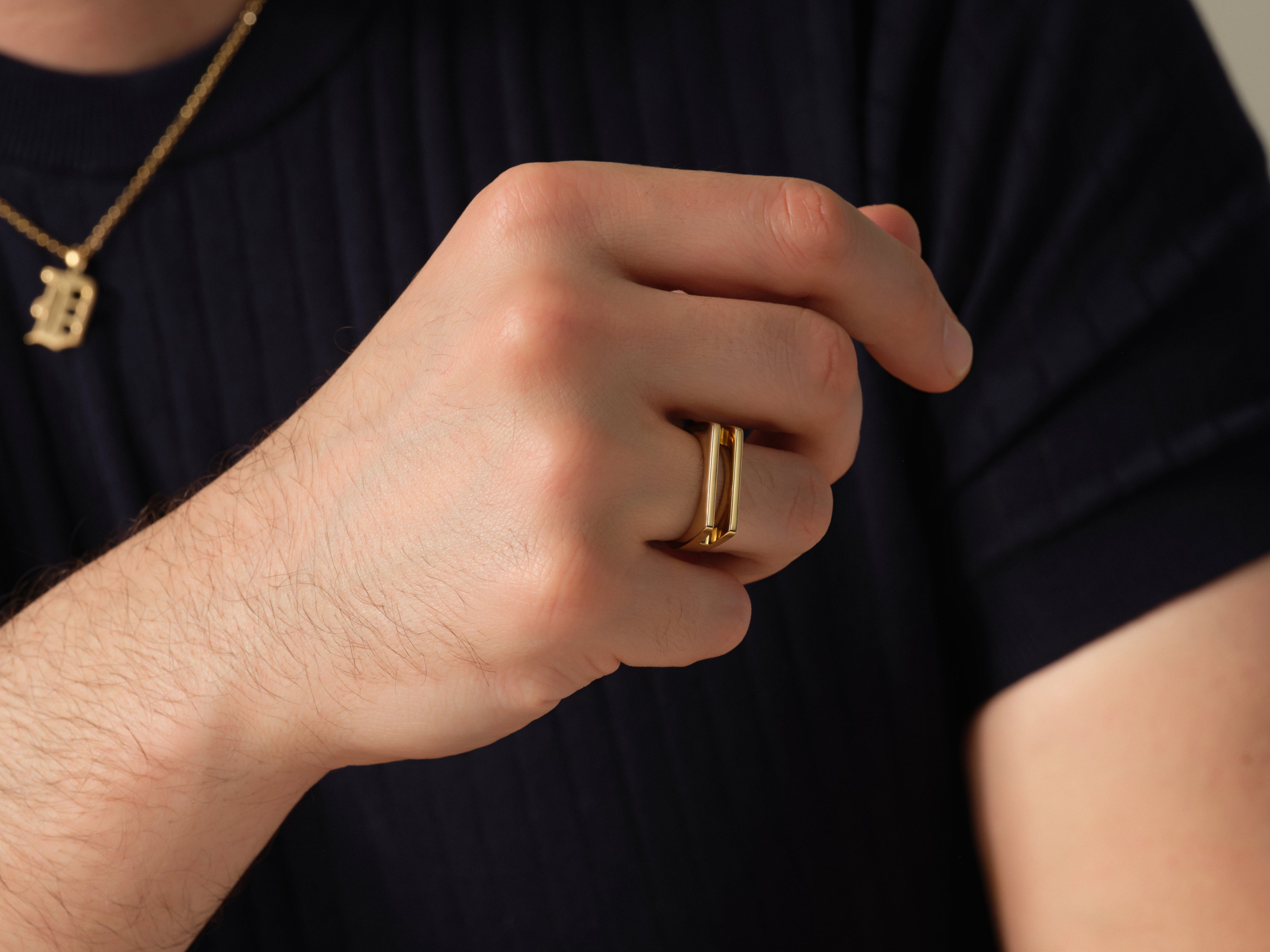 Gold geometric ring on hand, jewelry for men