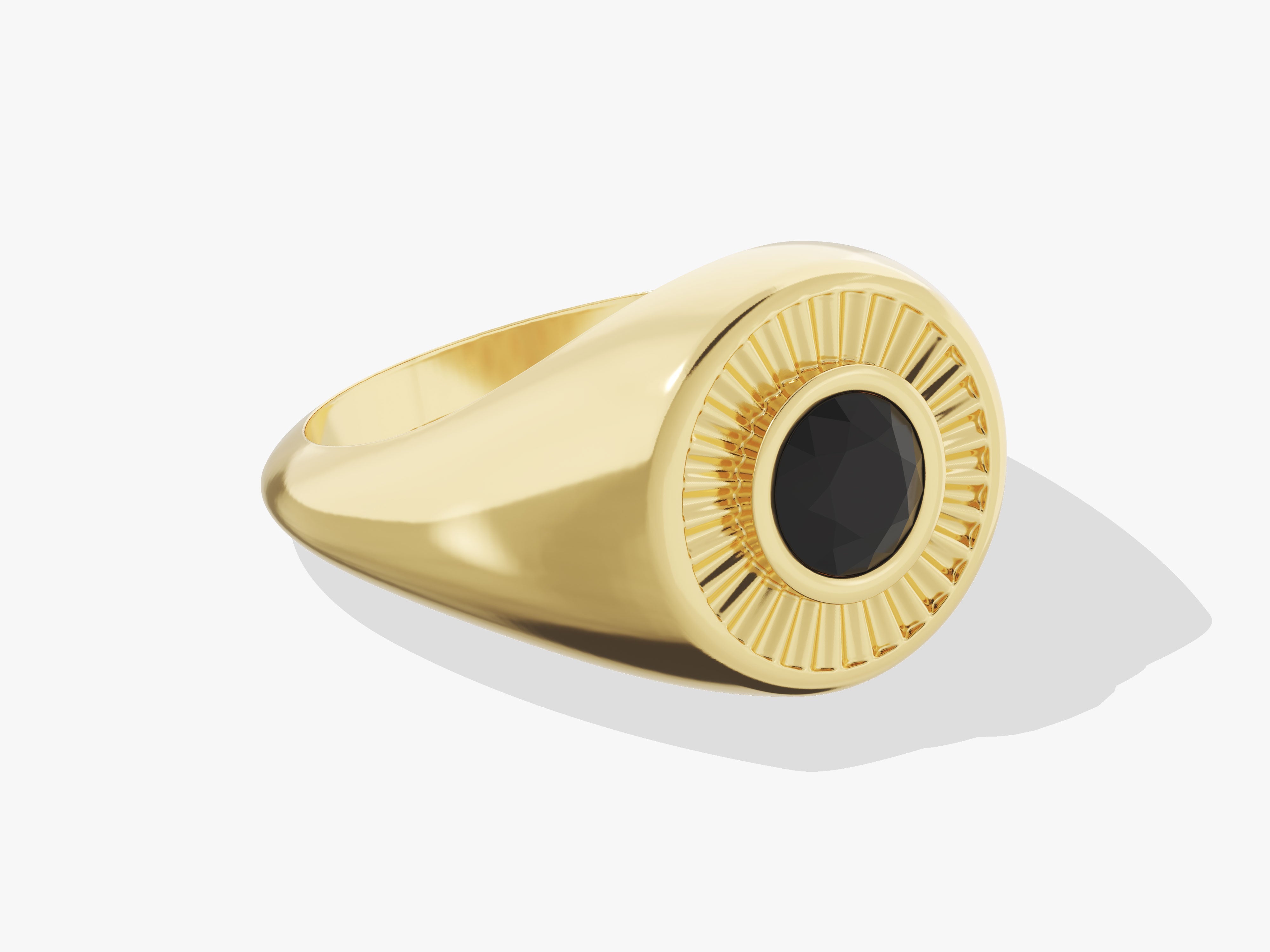 Gold signet ring with black gemstone and sunburst design