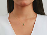 A video of a women model showing a yellow gold bezel set pear birthstone pendant necklacee on her neck