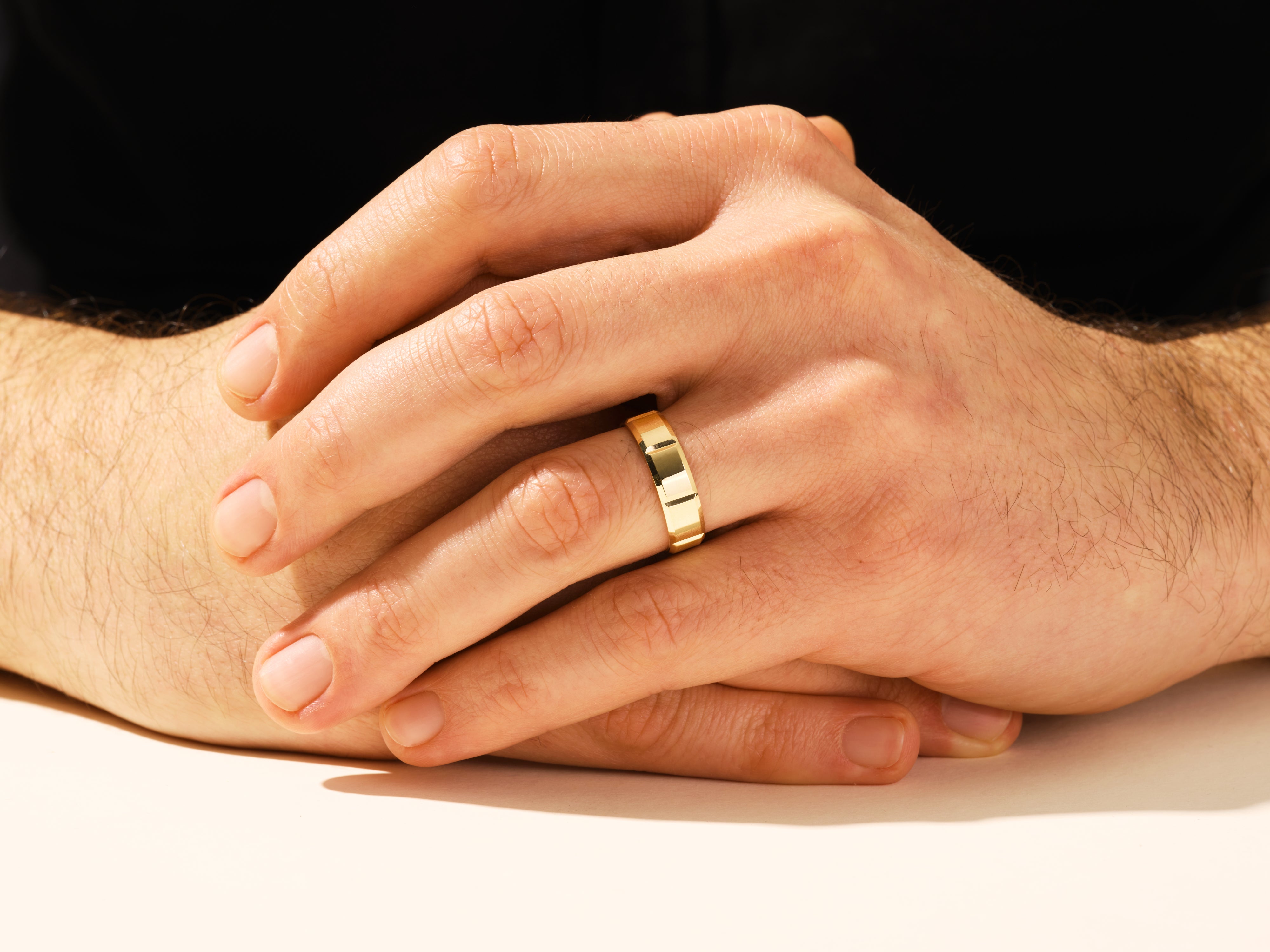Gold ring on man's finger, jewelry for men