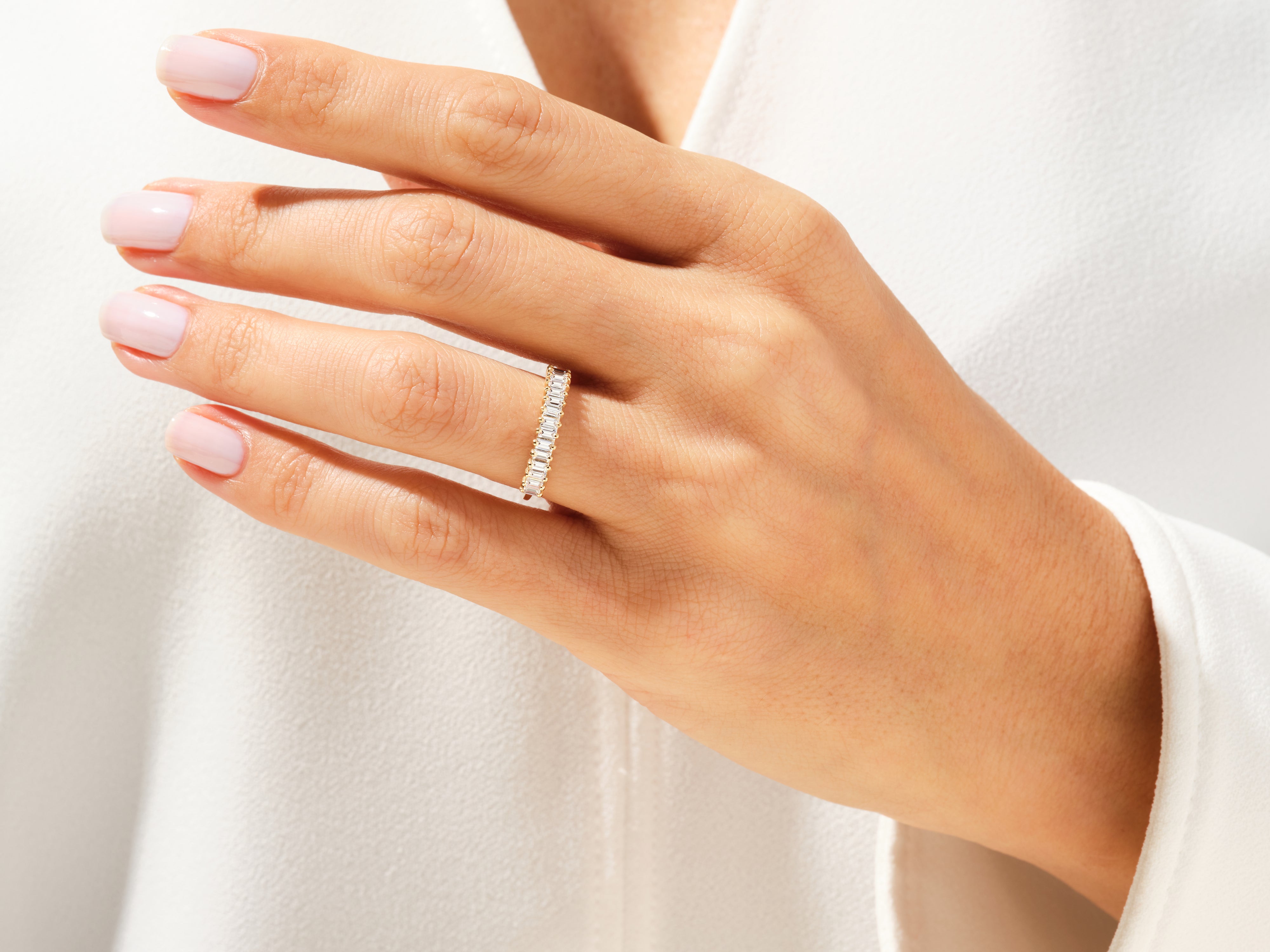 Diamond eternity ring on a woman's hand, elegant jewelry