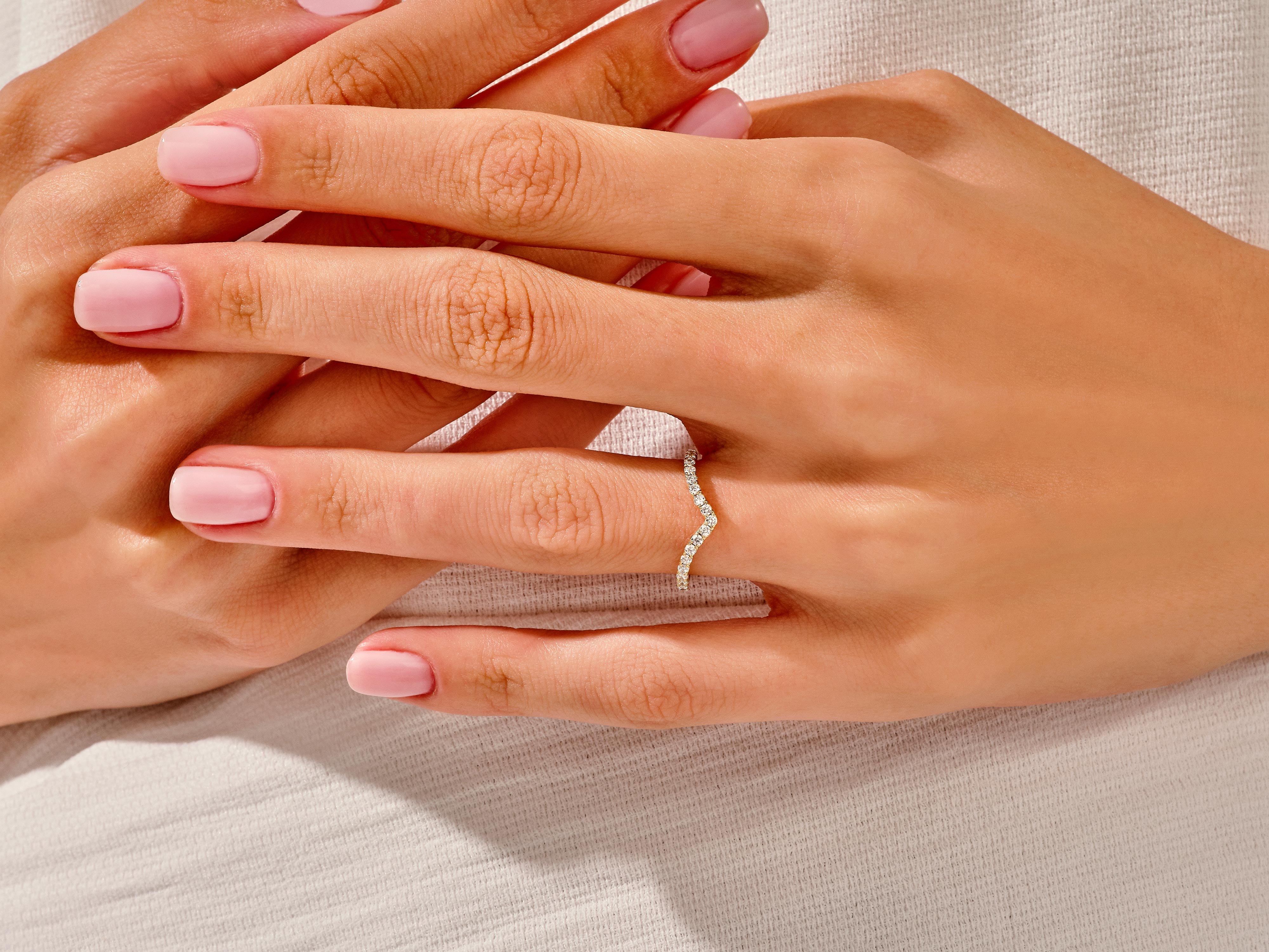 Diamond chevron ring on a hand, jewelry photography